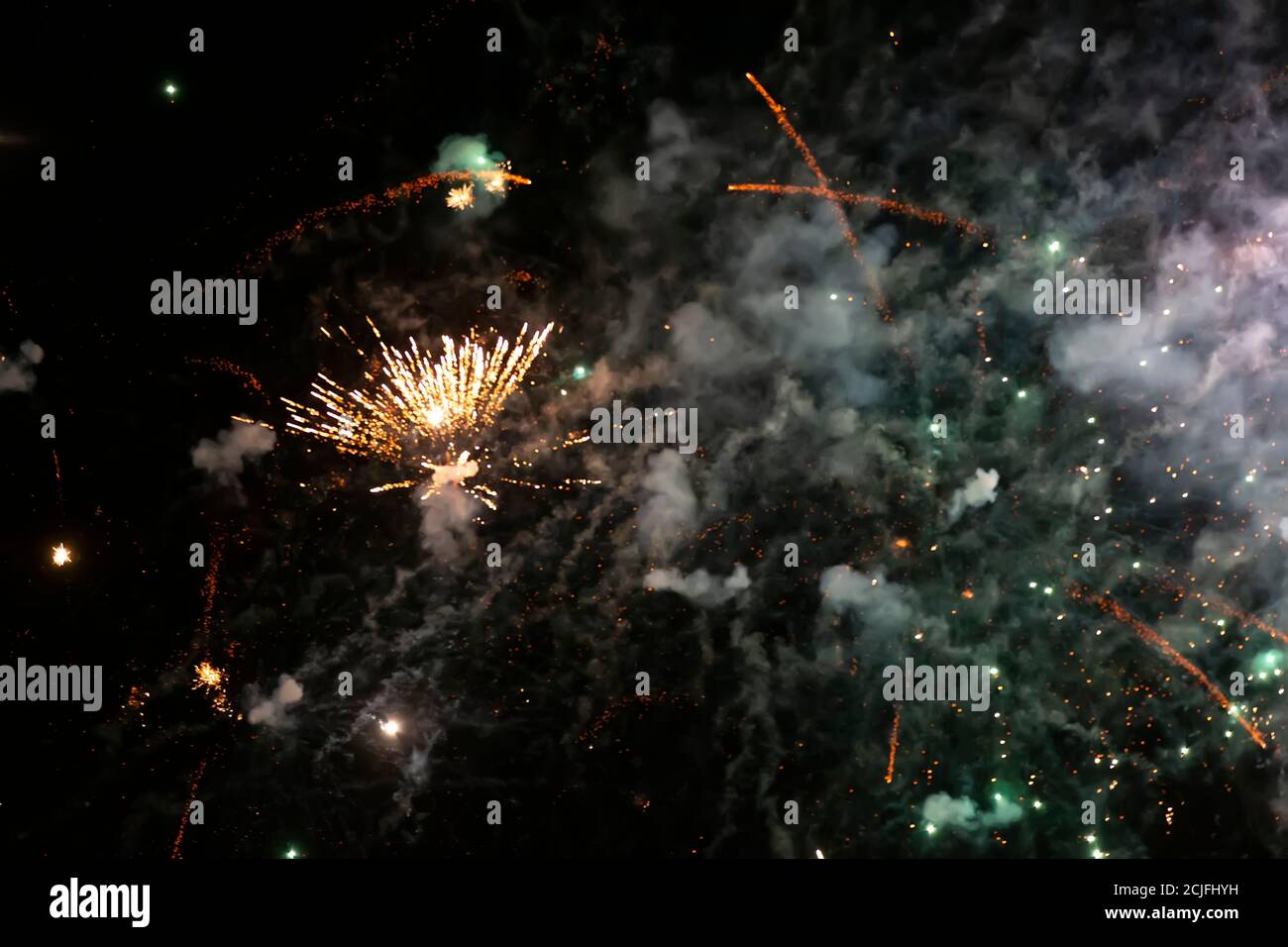 Bright spots of fireworks and colored smoke on a black background Stock Photo - Alamy