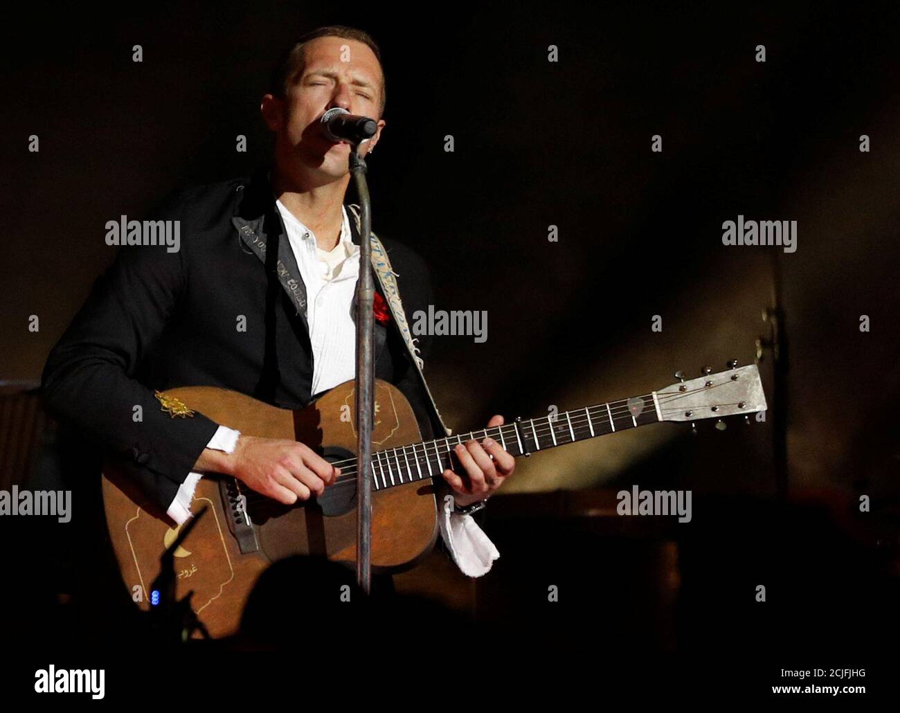 Coldplay lead singer Chris Martin performs during a show at the Natural