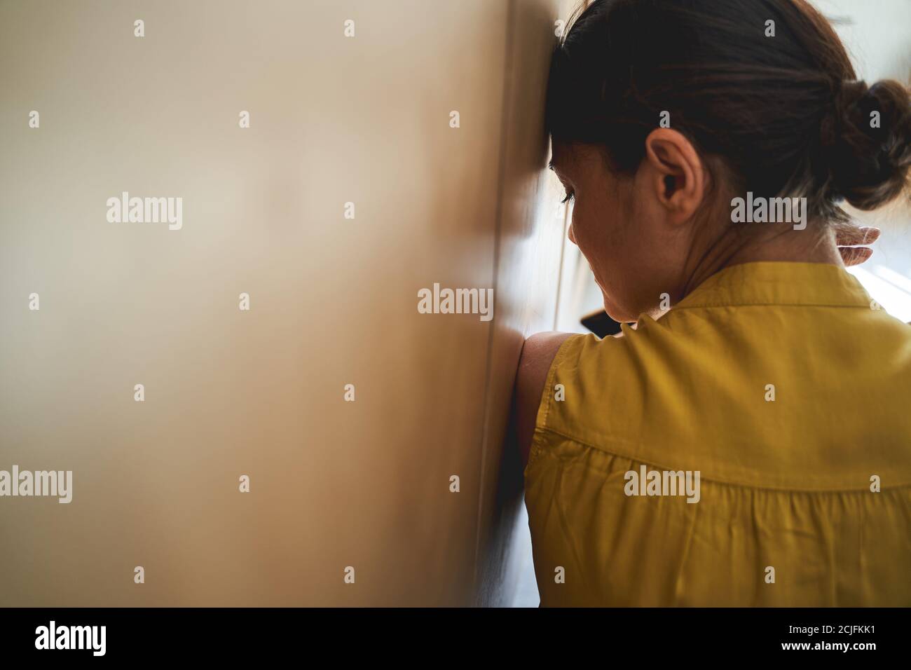 Lonely young female on dark hi-res stock photography and images - Alamy