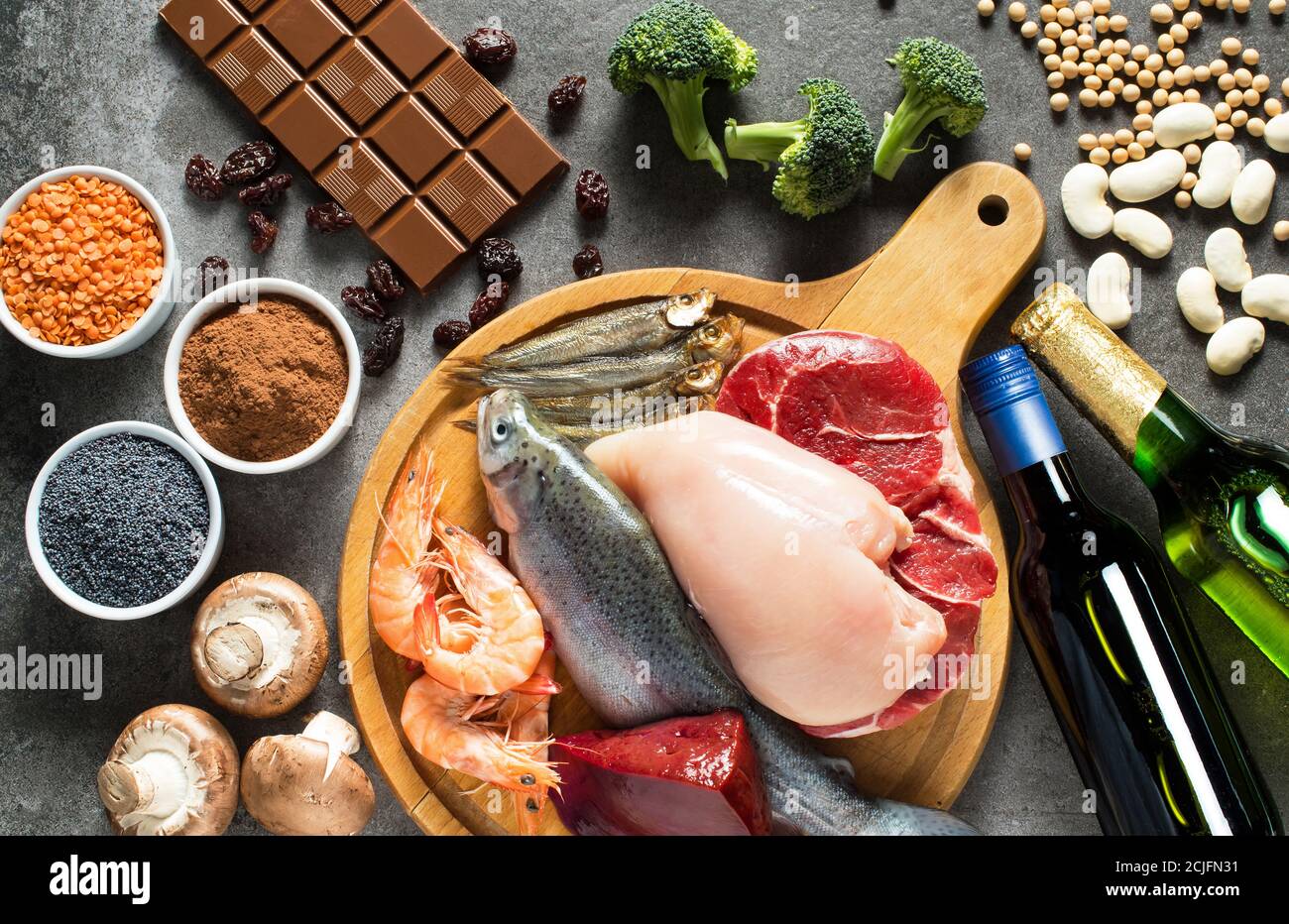 High purine foods. Foods that contain high levels of purines as trout, shrimps, chicken breast, red meat, sprats, liver, beans, chocolate, lentils, mu Stock Photo