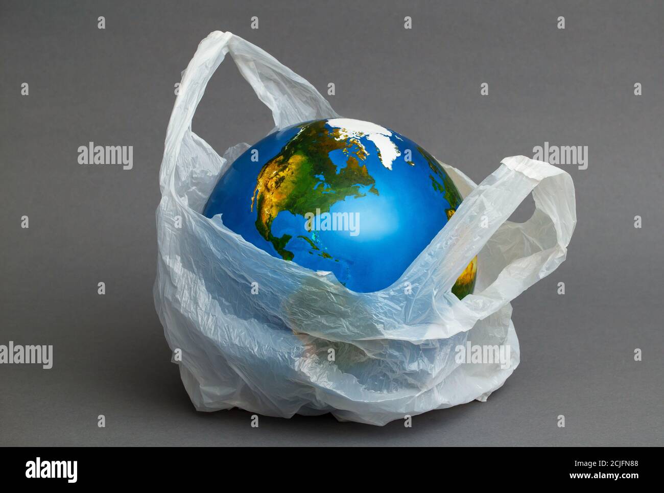 Global environmental pollution by plastic. Recycling concept Stock Photo