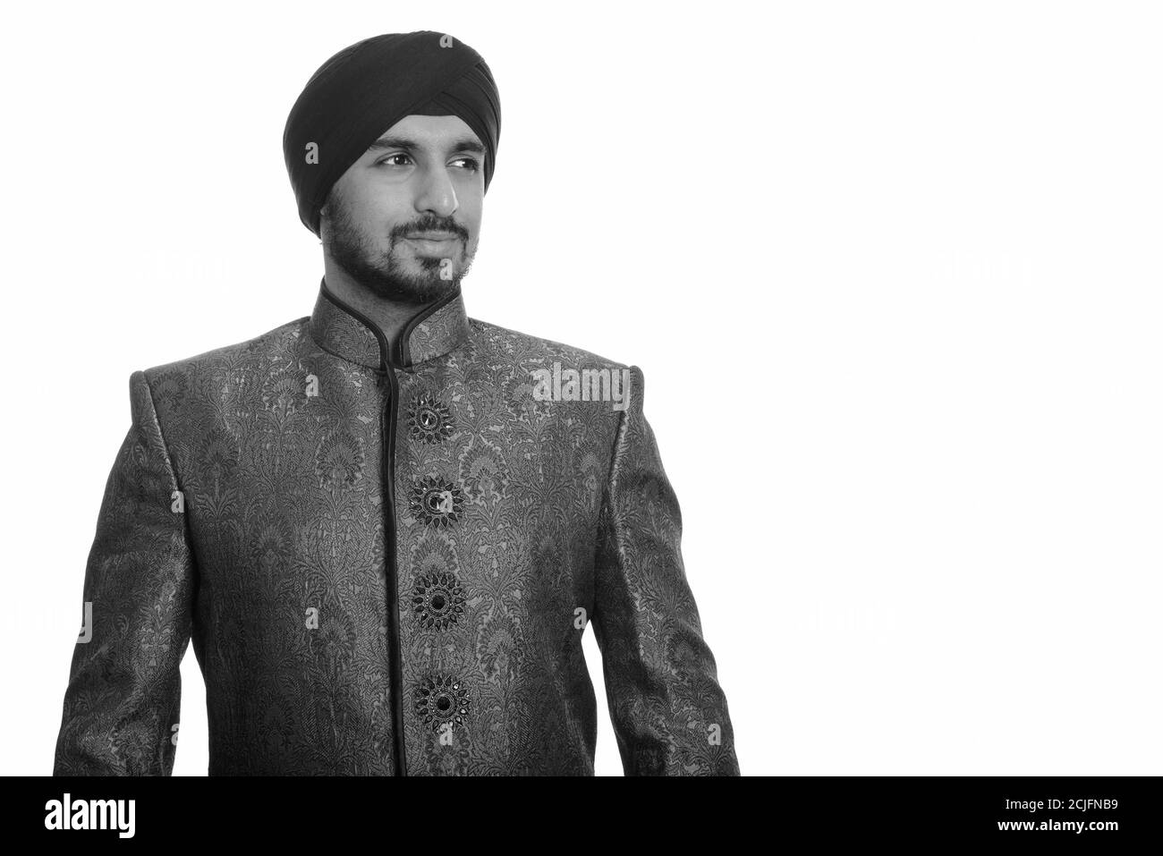 Young Handsome Indian Sikh Man Thinking While Wearing Traditional Young Handsome Indian Sikh Man Thinking While Wearing Traditional