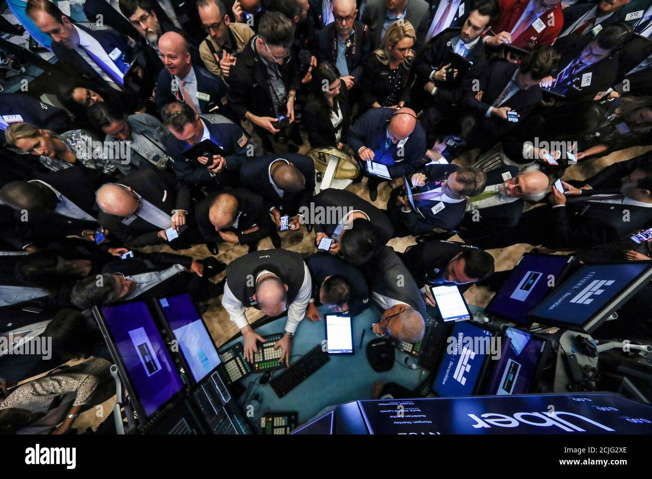 Traders and company executives gather for the Uber Technologies 