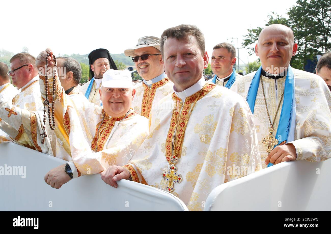 Priests wait for Pope Francis to arrive at the Liberty Field in Blaj,  Romania June 2, 2019. REUTERS/Remo Casilli Stock Photo - Alamy