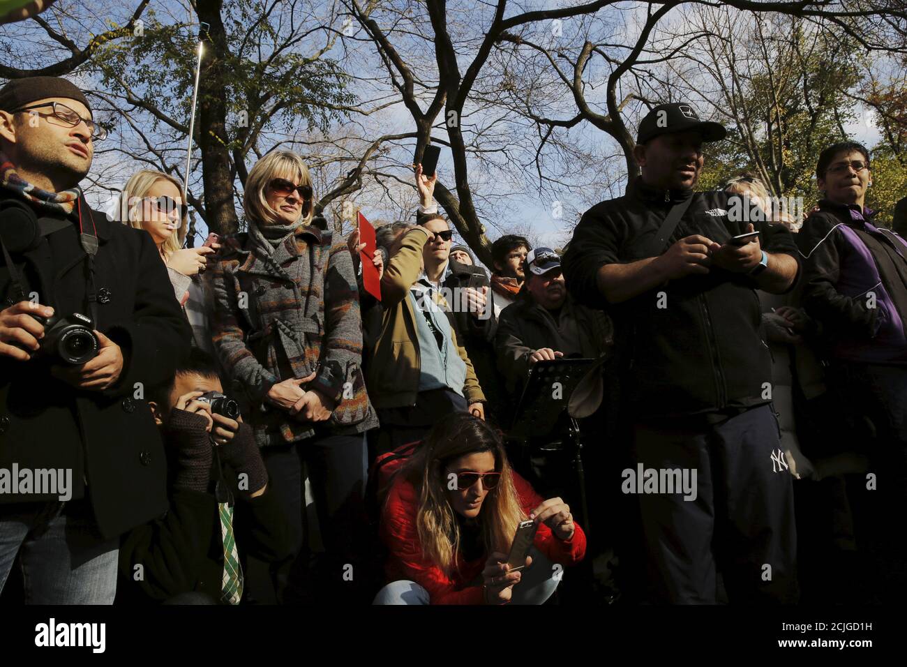 Fans Of Former Beatle John Lennon Gather At The Imagine Mosaic In The Strawberry Fields Section Of New York S Central Park To Mark The 35th Anniversary Of His Death In New York