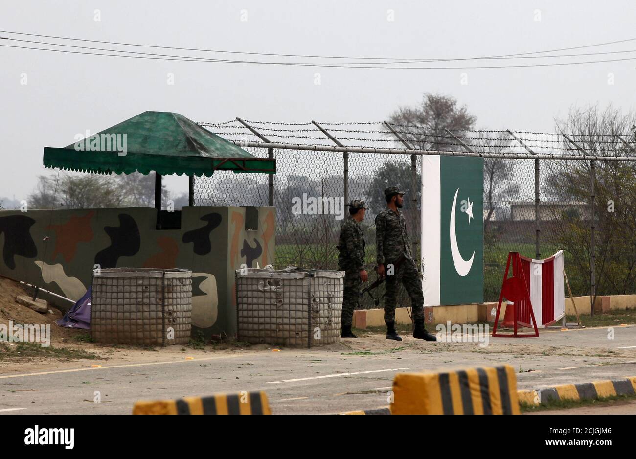 Paramilitary soldiers stand guard at a check post, before the release