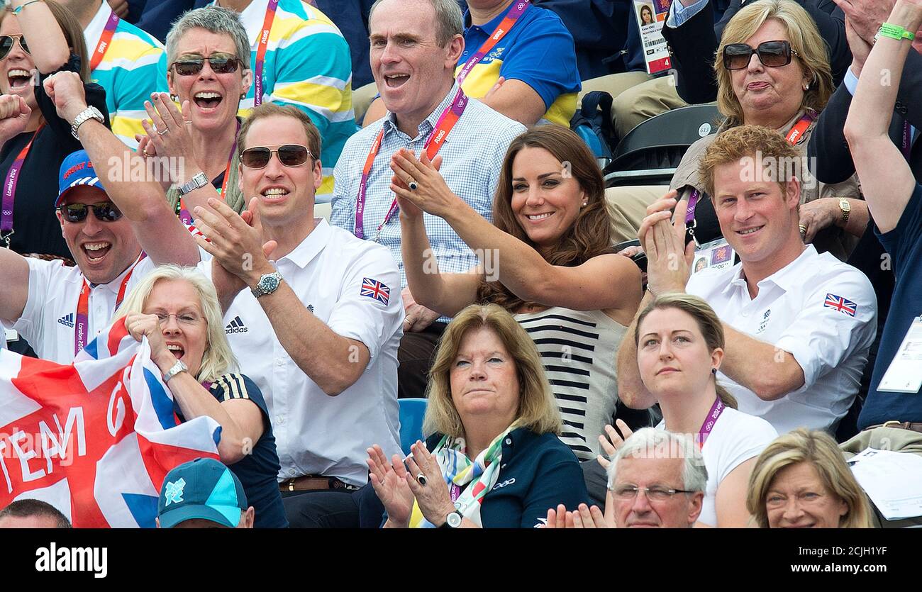 Prince William, Duchess of Cambridge and Prince Harry watch Zara Phillips win a silver medal in Eventing. 2012 London Olympics. Pic Credit : Mark Pain Stock Photo