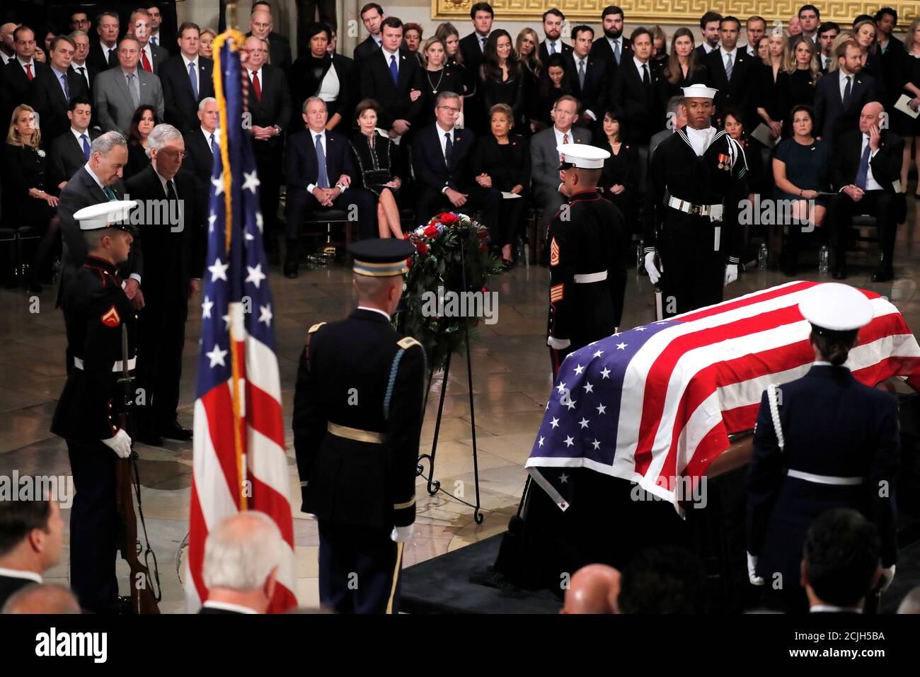 U.S. Senate majority and minority leaders Mitch McConnell (R-KY) and Chuck Schumer (D-NY) bow their heads during ceremonies for the late former U.S. President George H.W. Bush inside the U.S. Capitol rotunda in Washington D.C., U.S., December 3, 2018. REUTERS/Eric Thayer Stock Photo