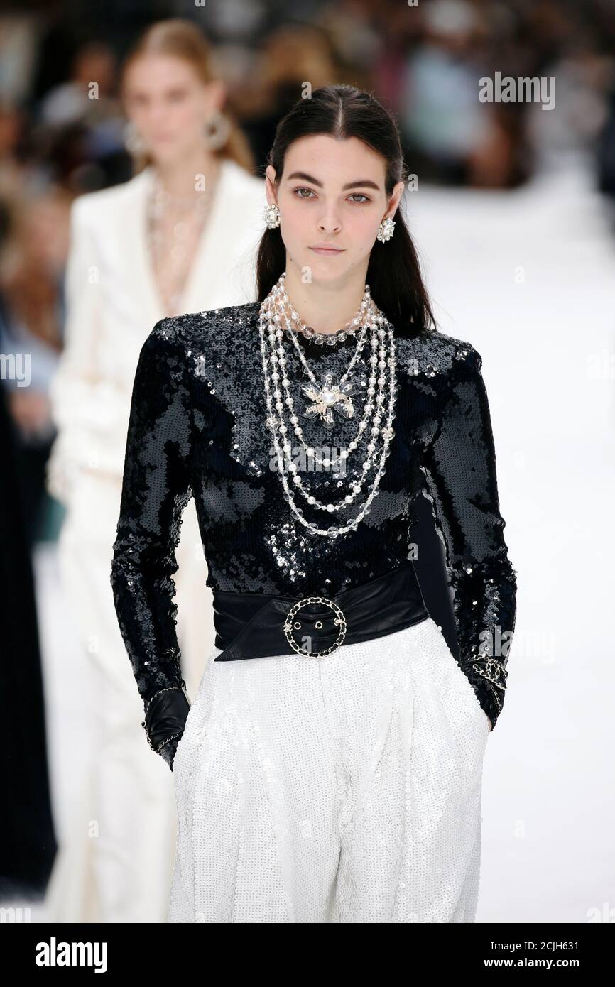 A model presents a creation by late designer Karl Lagerfeld as part of his  Fall/Winter 2019-2020 women's ready-to-wear collection show for fashion  house Chanel at the Grand Palais during Paris Fashion Week