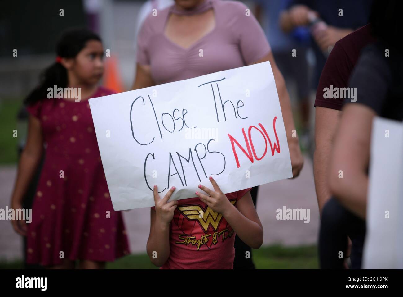 A child holds a sign during an immigration rights rally at Cleveland Square Park in El Paso, Texas, U.S. July 12, 2019. REUTERS/Daniel Becerril Stock Photo