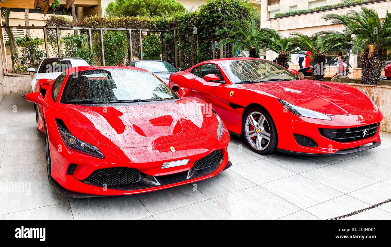 Monte-Carlo, Monaco. 10.09.2020 Two red Ferraris parked on the street in Monte-Carlo. Ferrari is Italian sports car. Stock Photo