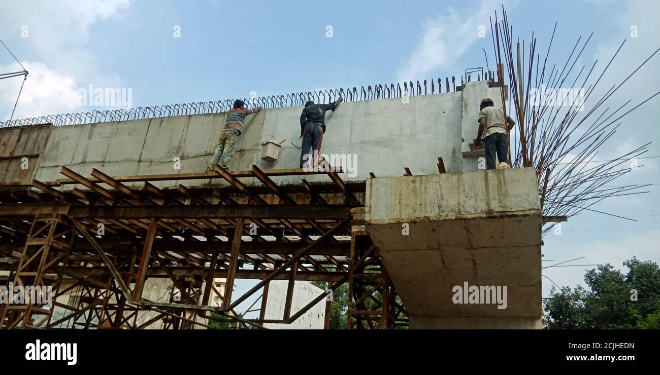 DISTRICT KATNI, INDIA - AUGUST 17, 2019: Indian village worker making over bridge during road site construction work. Stock Photo