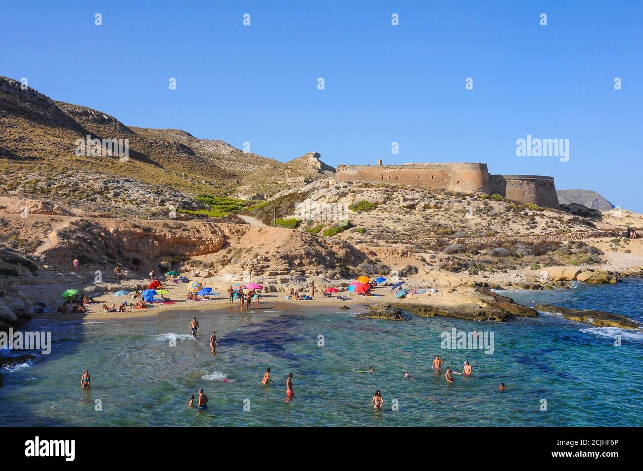 El Playazo de Rodalquilar and San Ramon Castle, beautiful beach in Cabo de Gata, Almeria, Spain Stock Photo