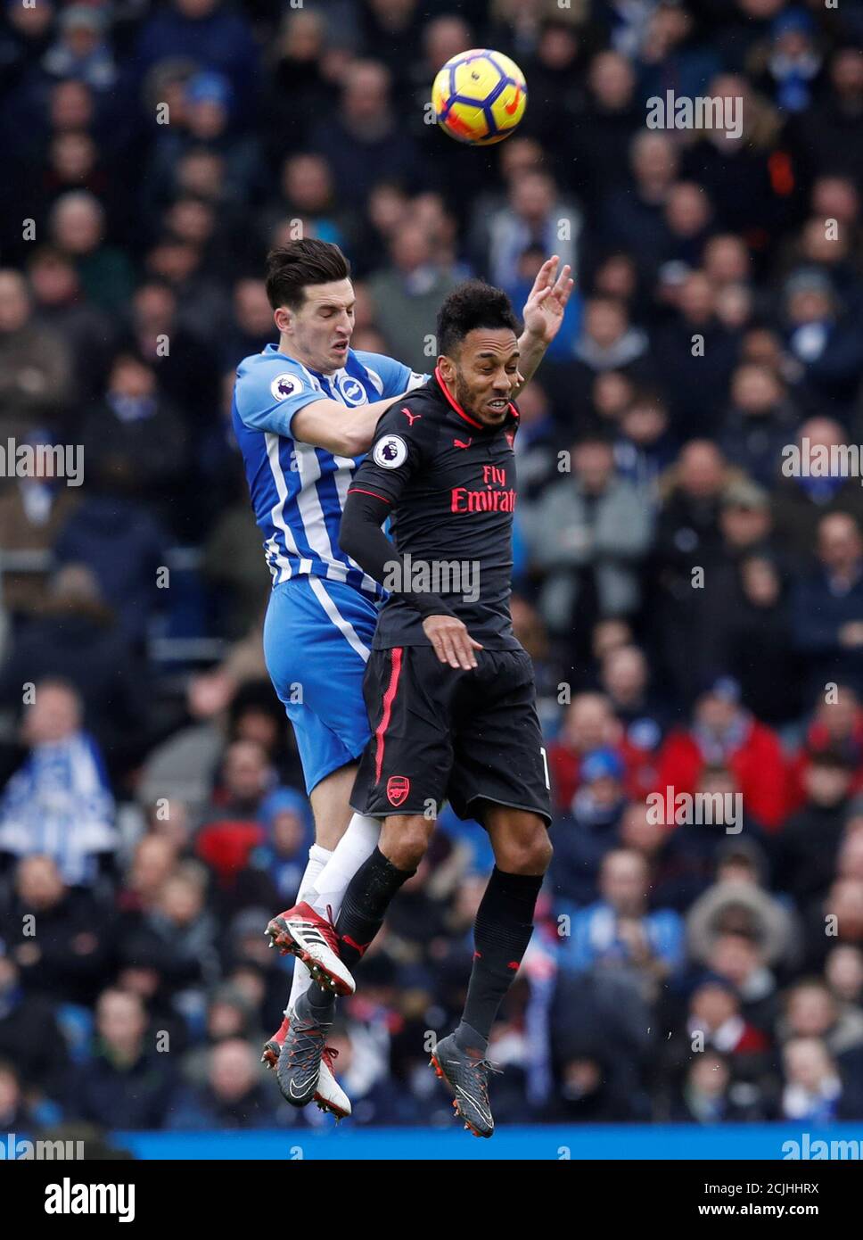 Soccer Football - Premier League - Brighton & Hove Albion vs Arsenal - The American Express Community Stadium, Brighton, Britain - March 4, 2018   Arsenal's Pierre-Emerick Aubameyang in action with Brighton's Lewis Dunk    REUTERS/Eddie Keogh    EDITORIAL USE ONLY. No use with unauthorized audio, video, data, fixture lists, club/league logos or 'live' services. Online in-match use limited to 75 images, no video emulation. No use in betting, games or single club/league/player publications.  Please contact your account representative for further details. Stock Photo