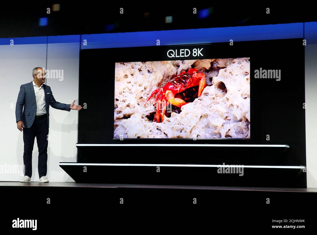 Dave Das, senior vice president of consumer electronics product marketing at Samsung Electronics America, shows off a 98-inch, QLED 8K smart television during a Samsung news conference at the 2019 CES in Las Vegas, Nevada, U.S. January 7, 2019. REUTERS/Steve Marcus Stock Photo