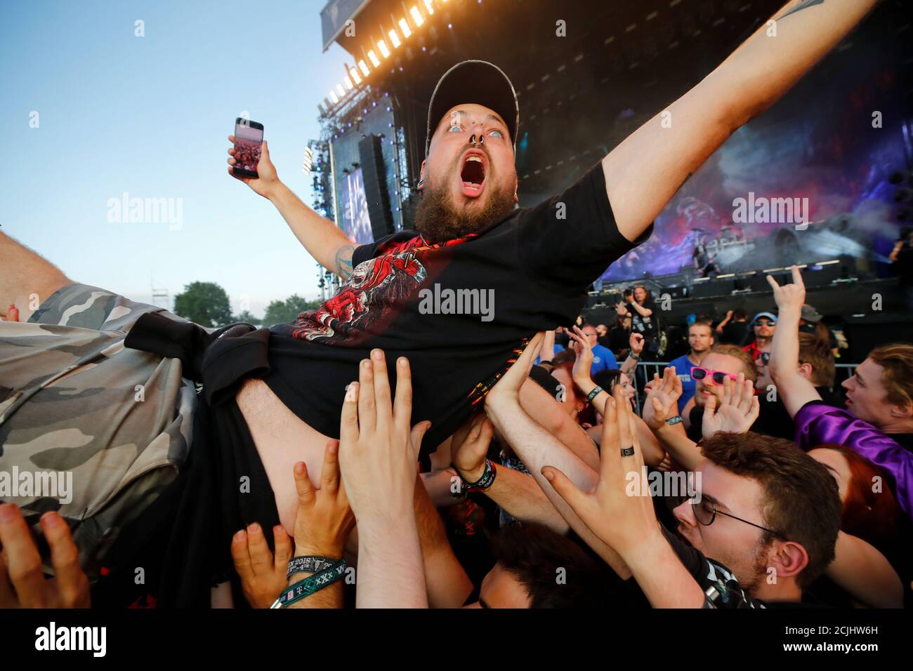 A fan takes a selfie as he surfs on top of the crowd during the performance  of the German power metal band Powerwolf at the world's largest heavy metal  festival, the Wacken