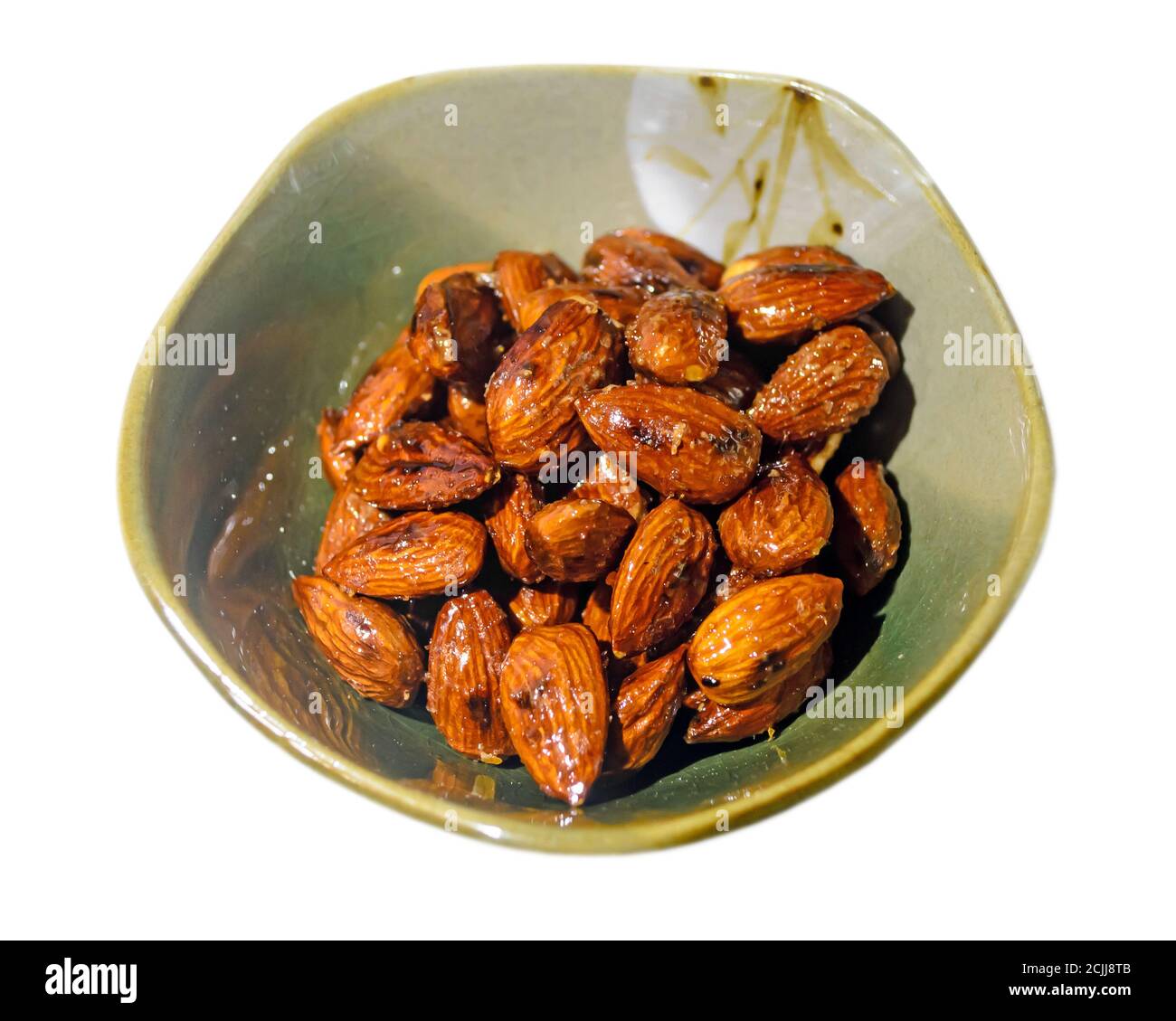 Roasted almonds with wasabi, maple syrup, soy sauce in a Asian bowl