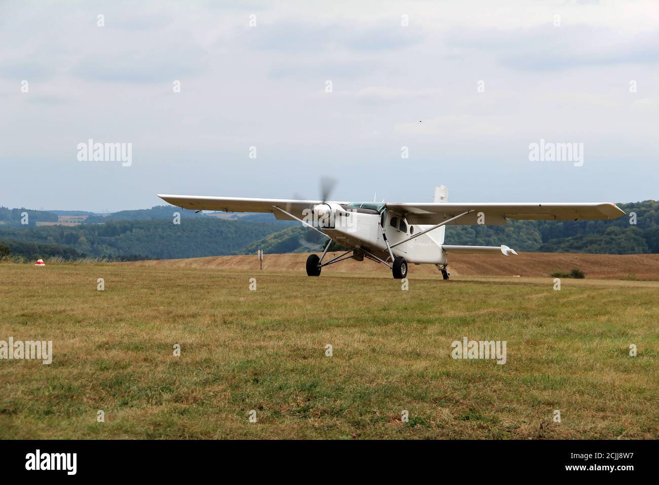 Unpowered plane landing on the airfield Stock Photo