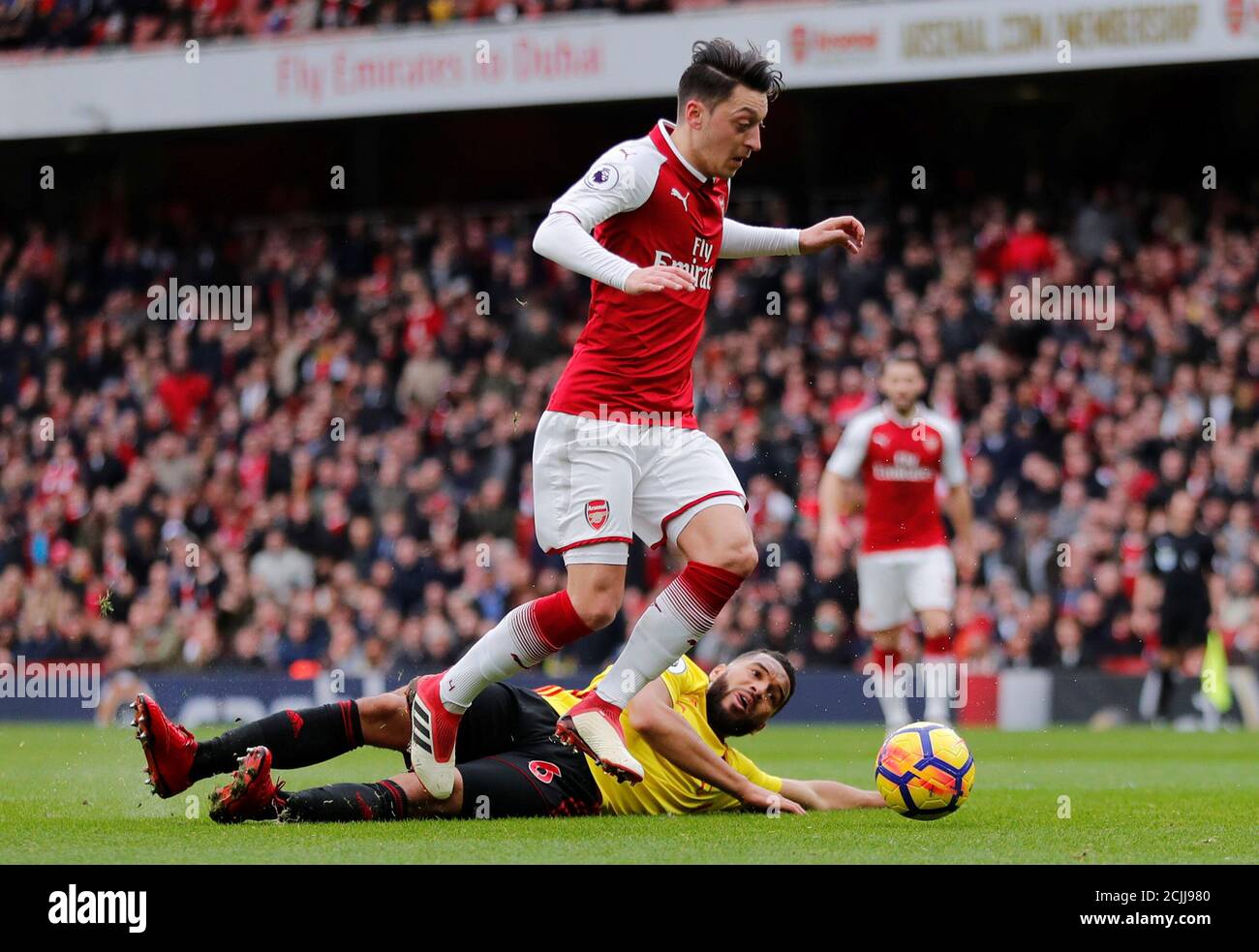 Soccer Football - Premier League - Arsenal vs Watford - Emirates Stadium, London, Britain - March 11, 2018   Arsenal's Mesut Ozil in action with Watford's Adrian Mariappa    REUTERS/Eddie Keogh    EDITORIAL USE ONLY. No use with unauthorized audio, video, data, fixture lists, club/league logos or "live" services. Online in-match use limited to 75 images, no video emulation. No use in betting, games or single club/league/player publications.  Please contact your account representative for further details. Stock Photo