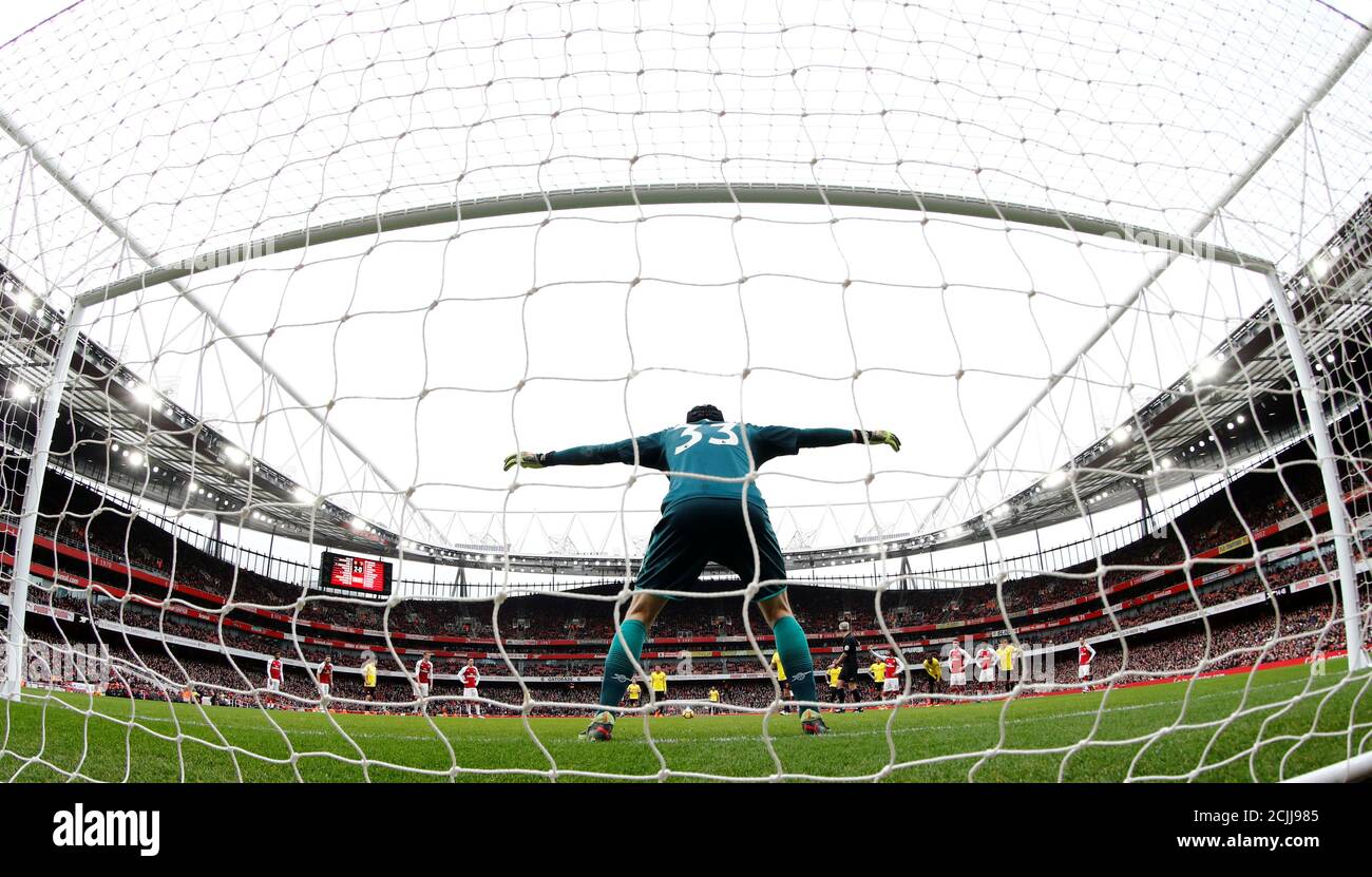 Soccer Football - Premier League - Arsenal vs Watford - Emirates Stadium, London, Britain - March 11, 2018 Arsenal's Petr Cech before saving a penalty from Watford's Troy Deeney REUTERS/Eddie Keogh EDITORIAL USE ONLY. No use with unauthorized audio, video, data, fixture lists, club/league logos or "live" services. Online in-match use limited to 75 images, no video emulation. No use in betting, games or single club/league/player publications. Please contact your account representative for further details. Stock Photo