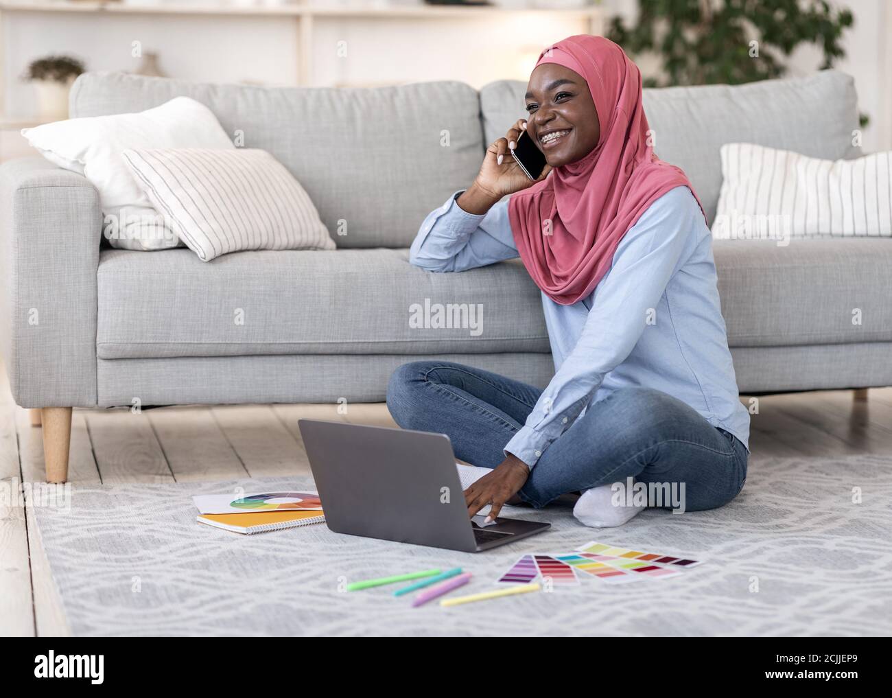 Remote Work For Muslim Women. Black Lady Using Cellphone And Laptop At Home Stock Photo Alamy