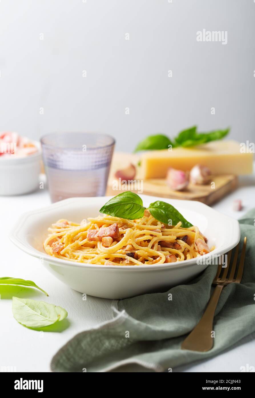 Italian pasta carbonara made with egg, hard cheese, cured pork