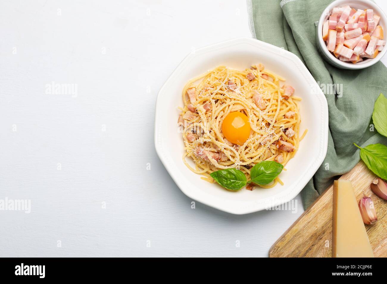 Italian pasta carbonara made with egg, hard cheese, cured pork