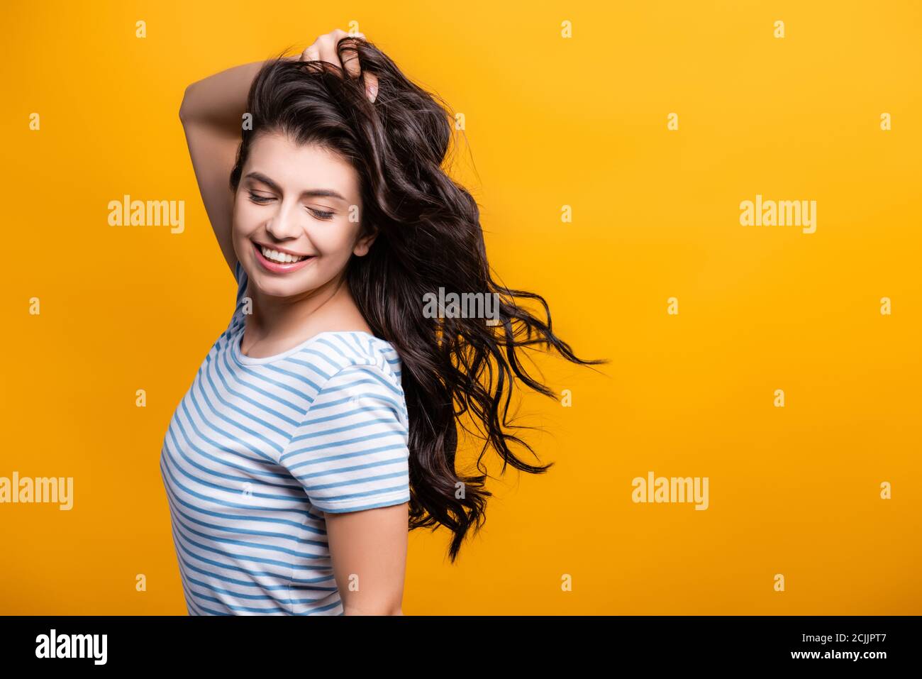 Woman long curly hair blowing hi-res stock photography and images - Alamy
