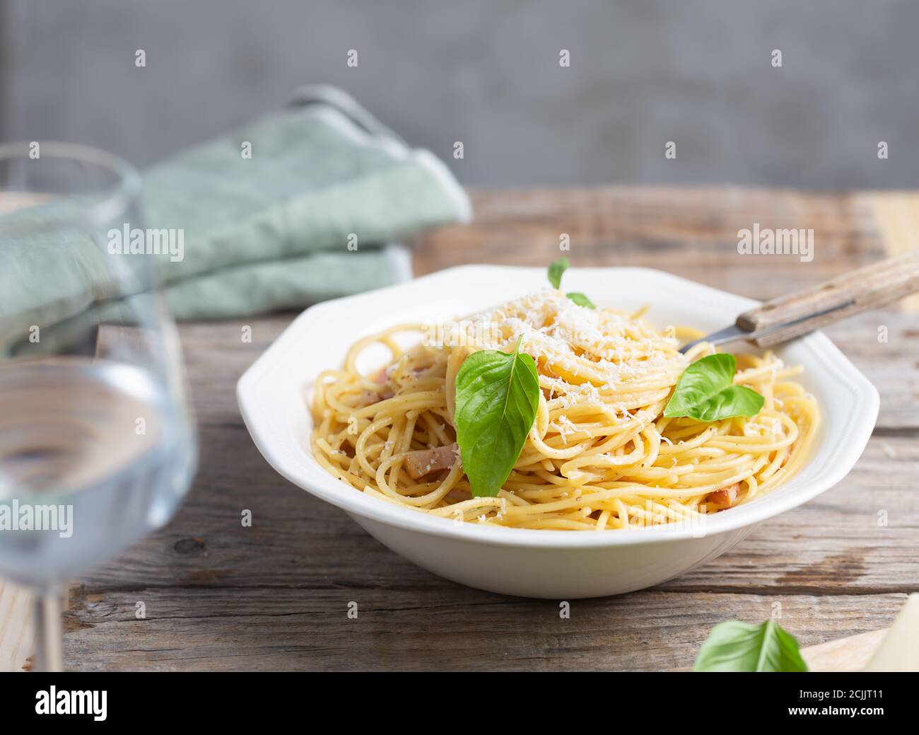 Italian pasta carbonara made with egg, hard cheese, cured pork