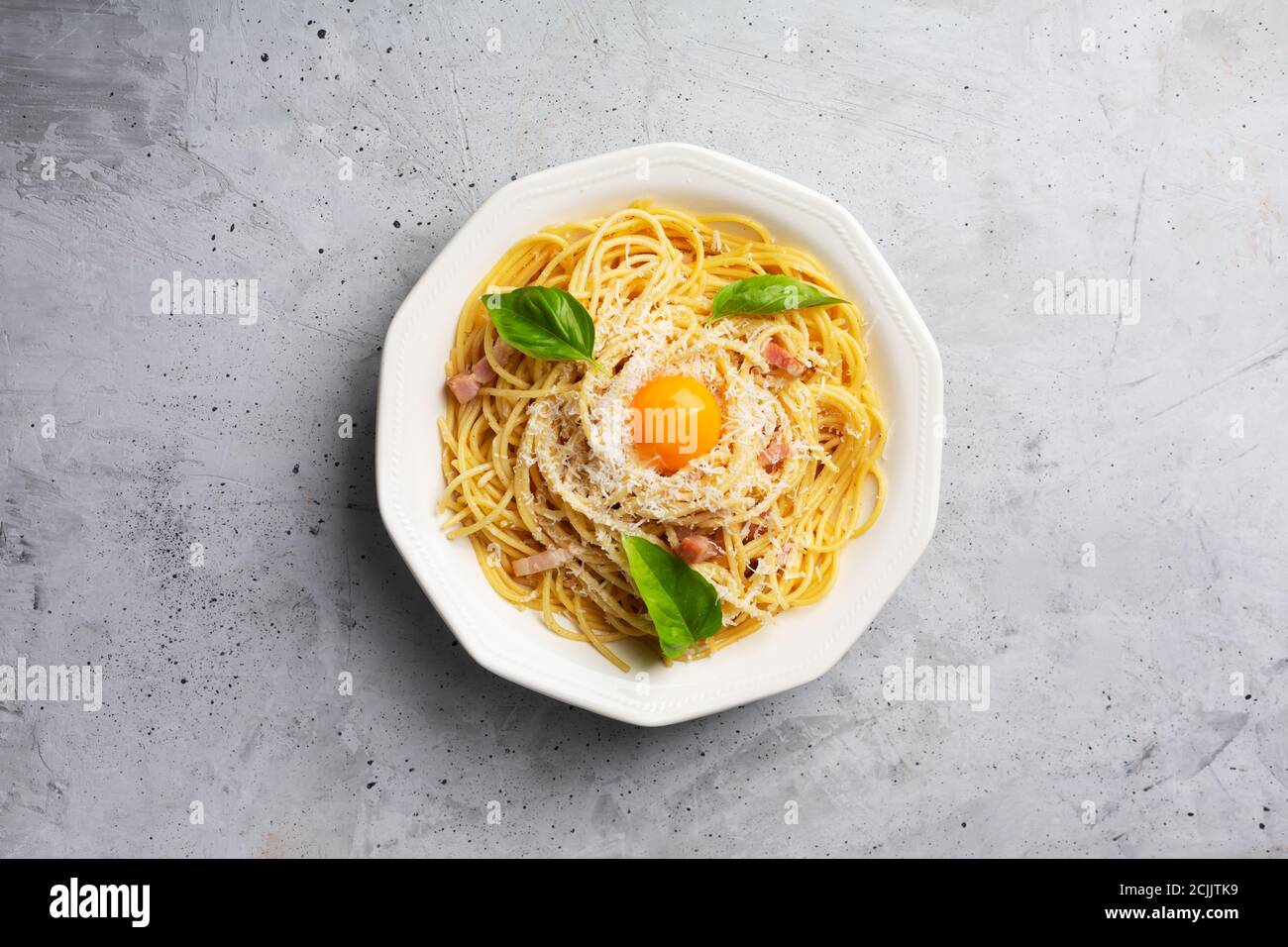 Italian pasta carbonara made with egg, hard cheese, cured pork