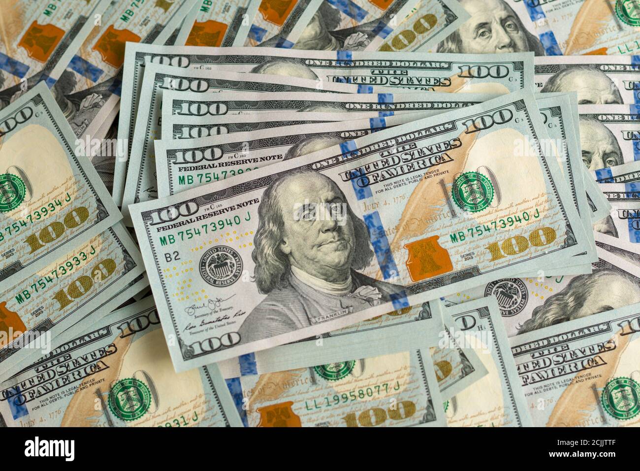 background with a lot of 100 dollar bills Stock Photo