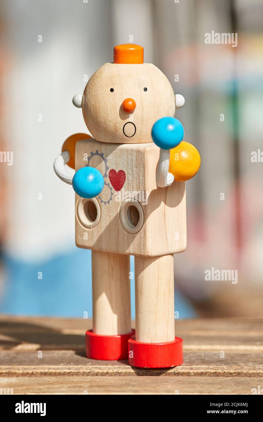 Wooden toy robot with red heart and surprise face. Defocused background  Stock Photo - Alamy