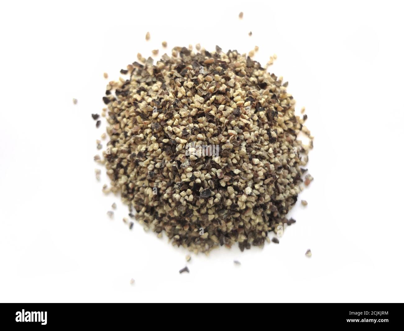 Coarse Ground Black Pepper (isolated on white background) Stock Photo