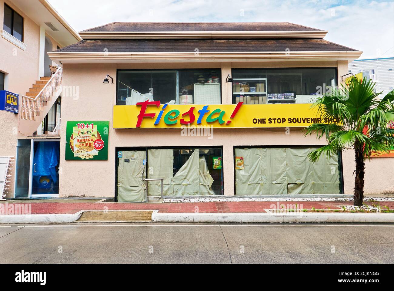 Souvenir shops and hotels on Boracay Island, Philippines, are closed because of the pandemic. Streets are empty with no people, shop windows covered. Stock Photo