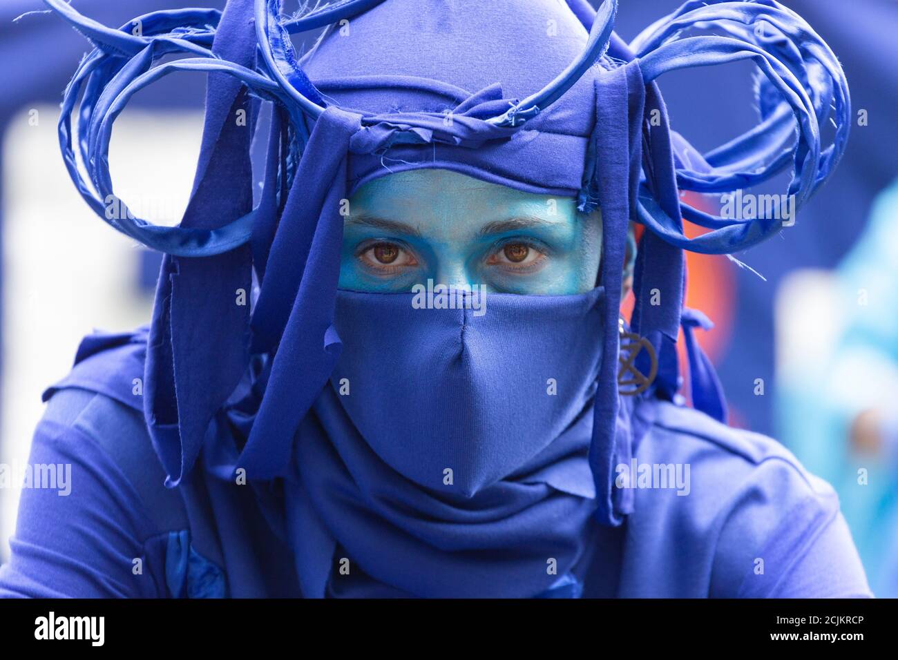 Performer in costume at 'Marine Extinction March', Extinction Rebellion demonstration, Parliament Square, London, 6 September 2020 Stock Photo