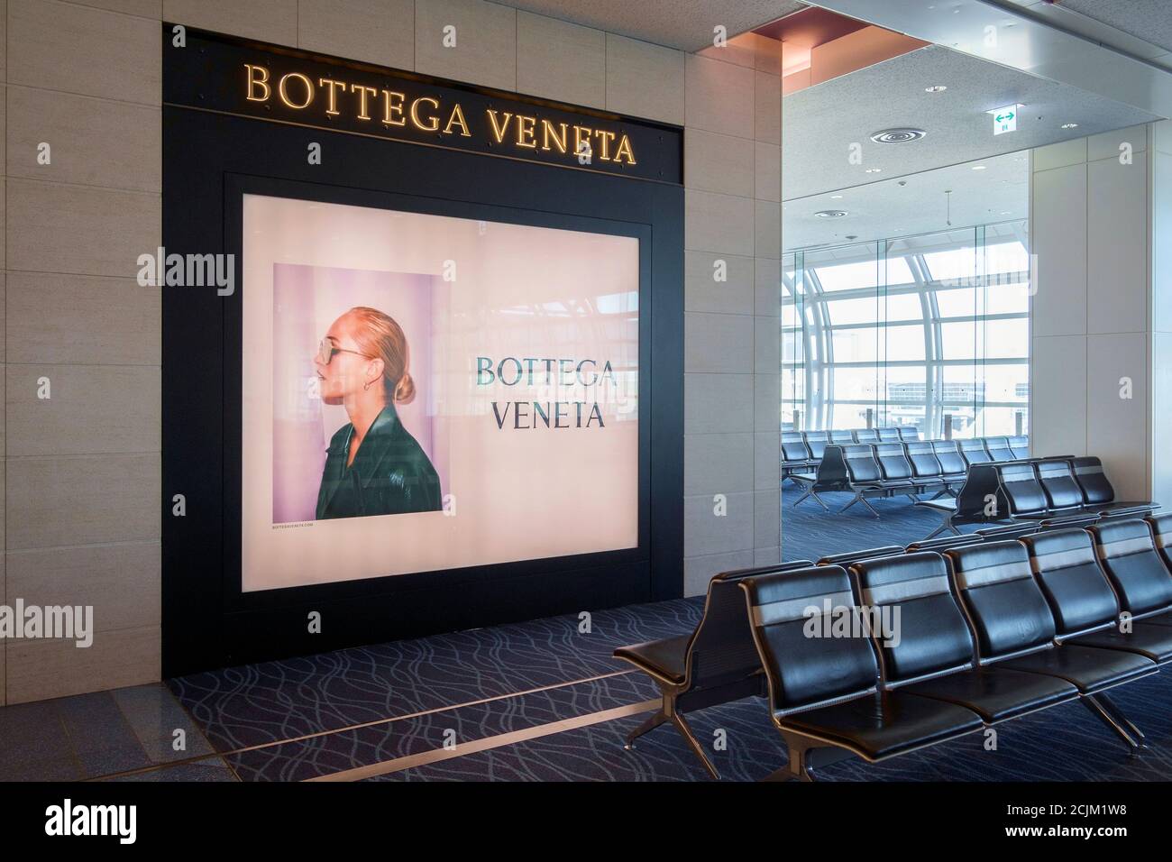 Bottega Veneta advertising billboard in the airport of Munich, Germany. Stock Photo