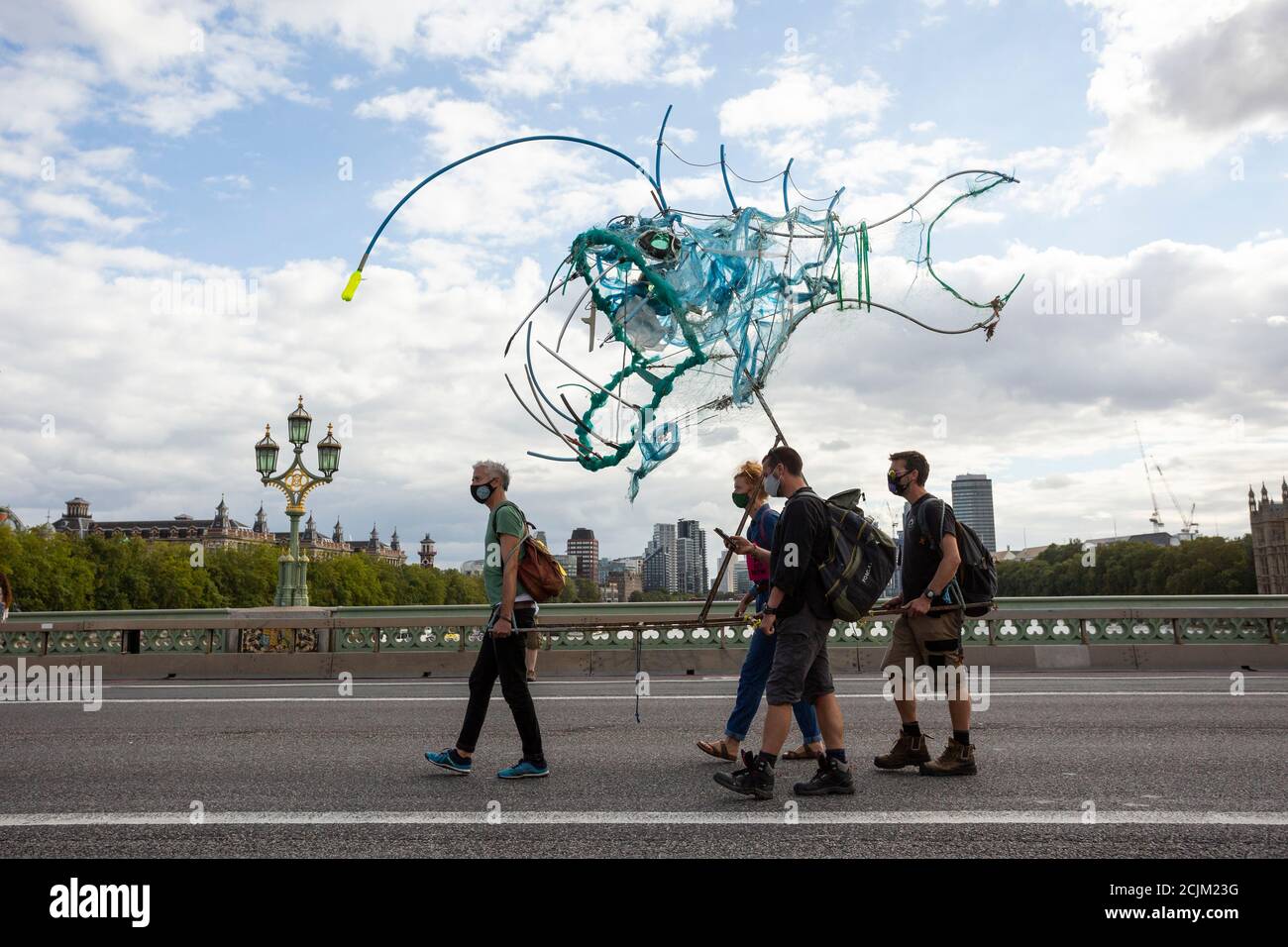 Protesters carrying deep sea fish across Westminster Bridge, 'Marine Extinction March', Extinction Rebellion, London, 6 September 2020 Stock Photo