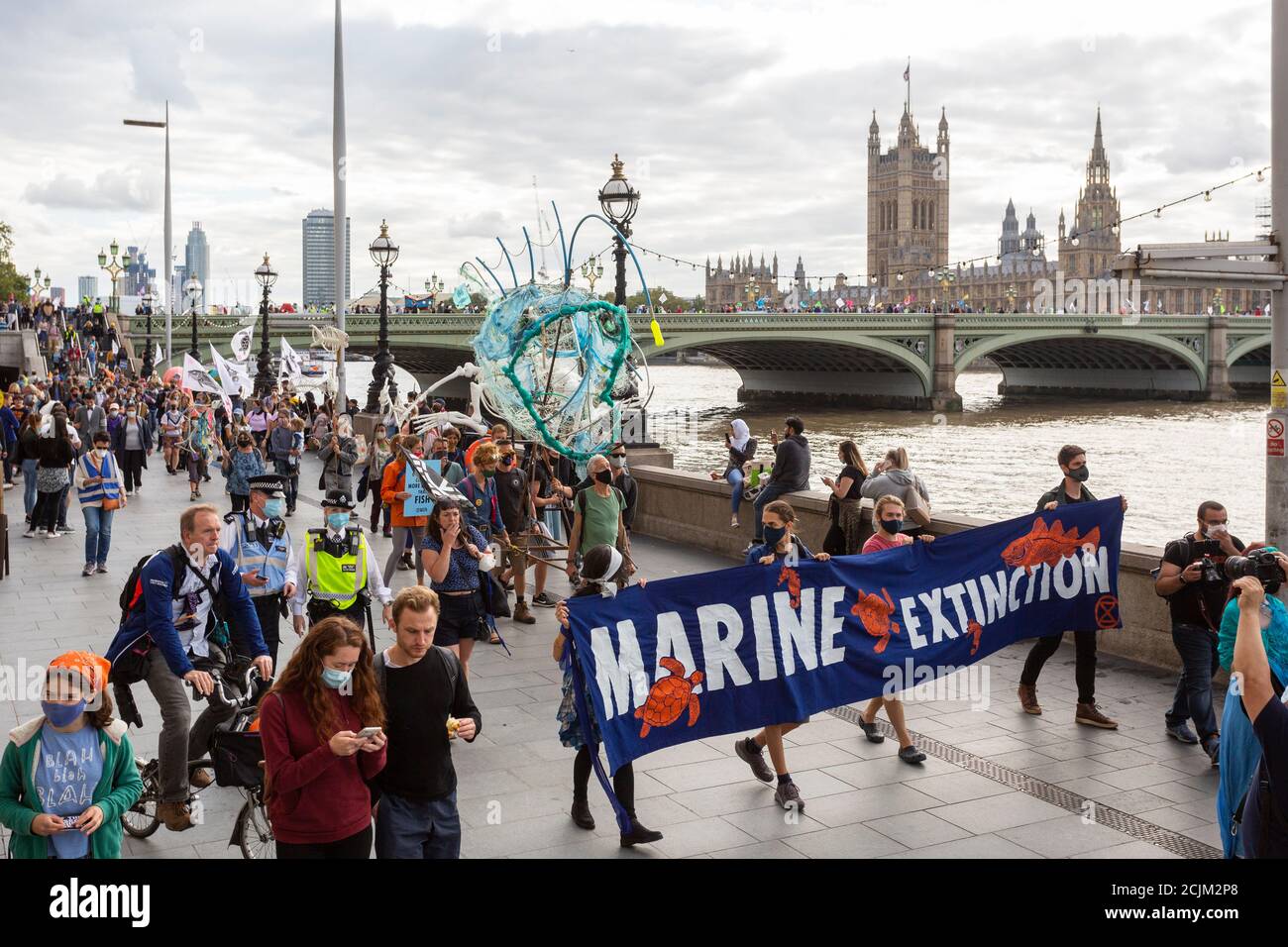 Protesters with banner during 'Marine Extinction March', Extinction Rebellion demonstration, South Bank, London, 6 September 2020 Stock Photo