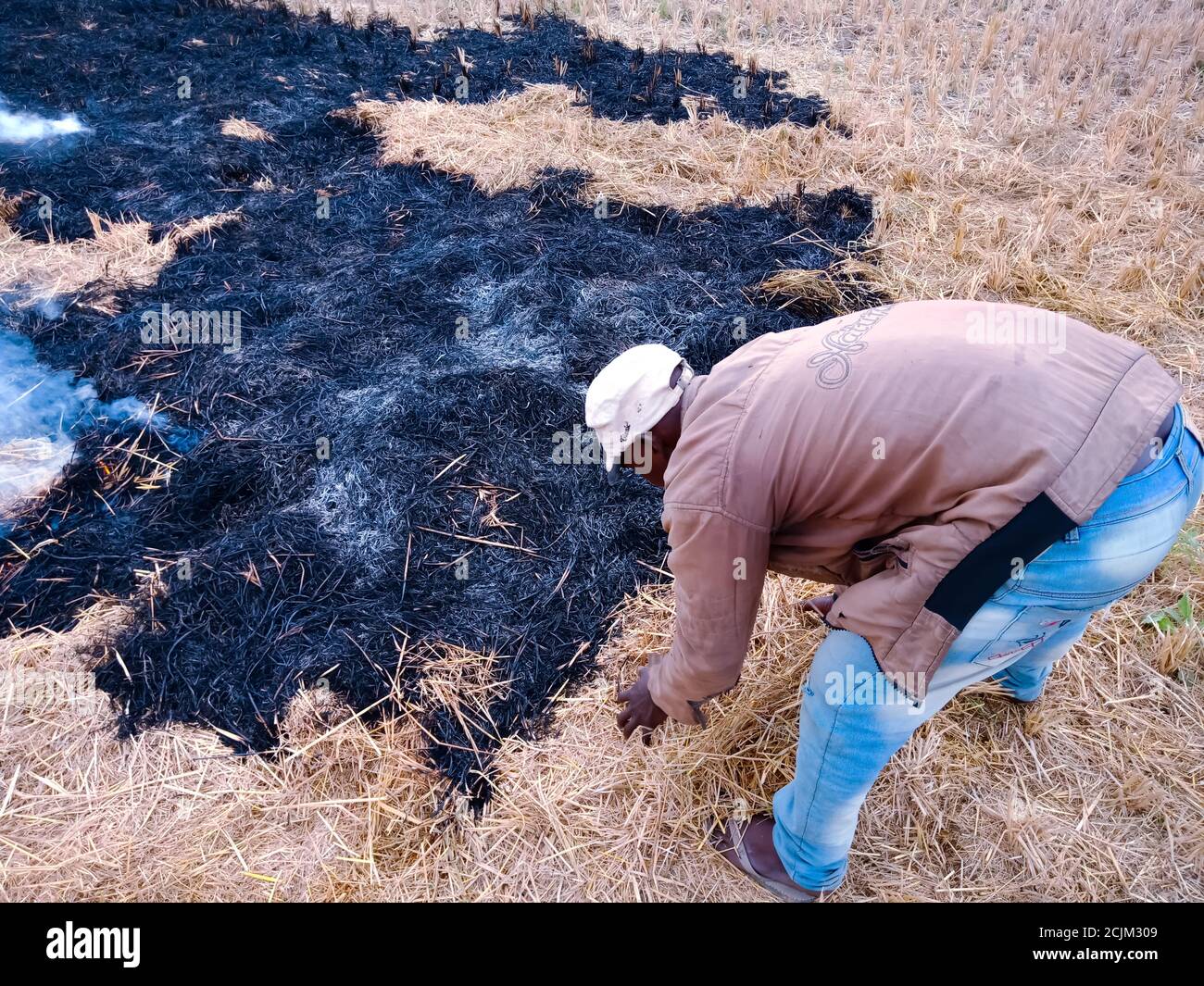 DISTRICT KATNI, INDIA OCTOBER 06, 2019 An indian poor farmer burning