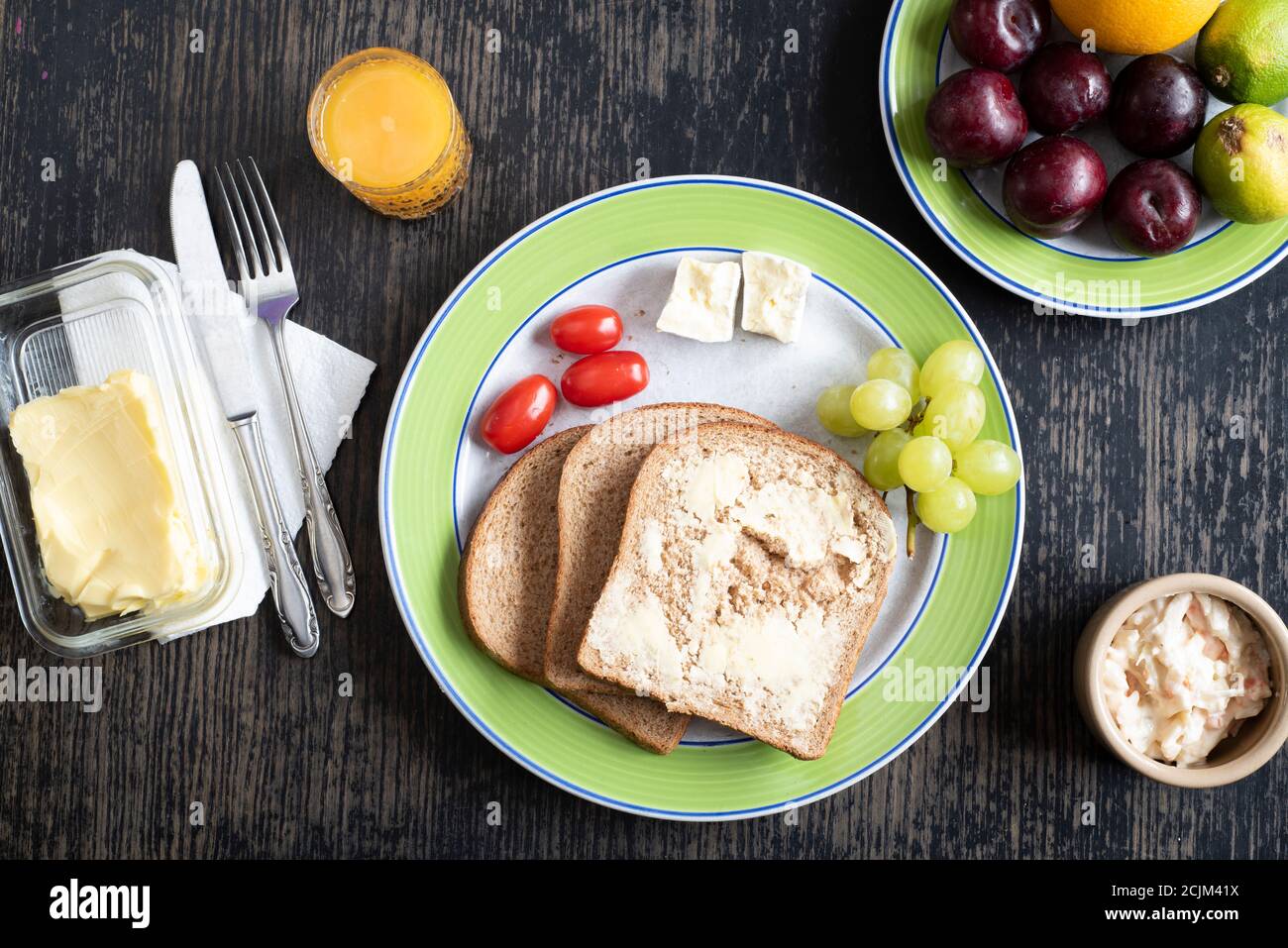 Lunchtime Open Sandwich Two Slices Of Bread Butter Cheese Tomatoes And Grapes On A Plate With Fruit Coleslaw And A Glass Of Orange Juice Stock Photo Alamy Lunchtime Open Sandwich Two Slices Of Bread Butter Cheese Tomatoes And Grapes On A Plate With Fruit Coleslaw And A Glass Of Orange Juice Stock Photo Alamy
