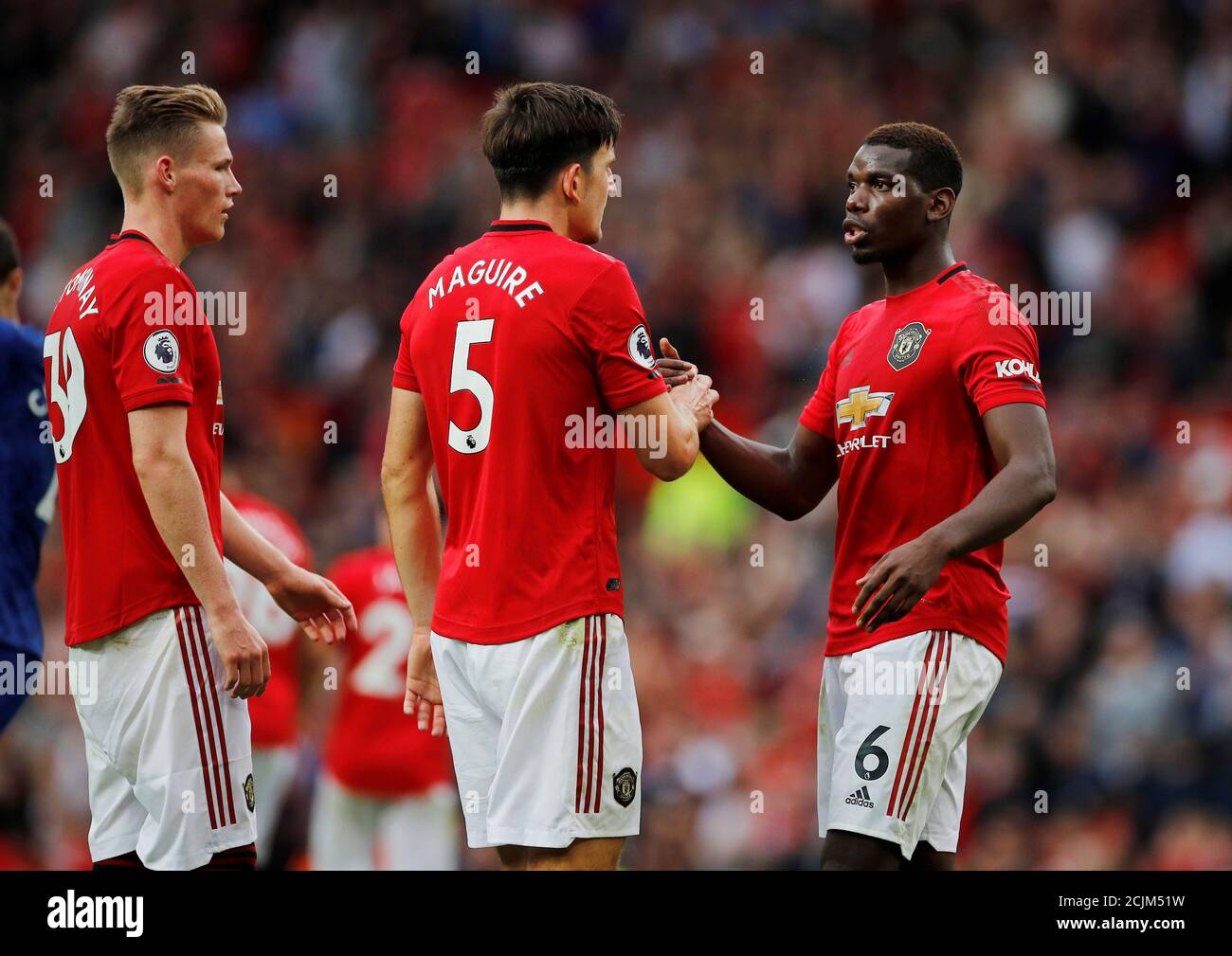 Soccer Football - Premier League - Manchester United v Chelsea - Old Trafford, Manchester, Britain - August 11, 2019  Manchester United's Harry Maguire and Paul Pogba celebrate at the end of the match  REUTERS/Phil Noble  EDITORIAL USE ONLY. No use with unauthorized audio, video, data, fixture lists, club/league logos or 'live' services. Online in-match use limited to 75 images, no video emulation. No use in betting, games or single club/league/player publications.  Please contact your account representative for further details. Stock Photo