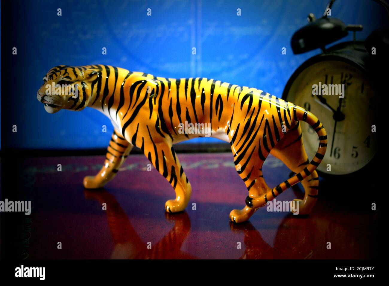 Closeup of a small tiger statue Stock Photo - Alamy