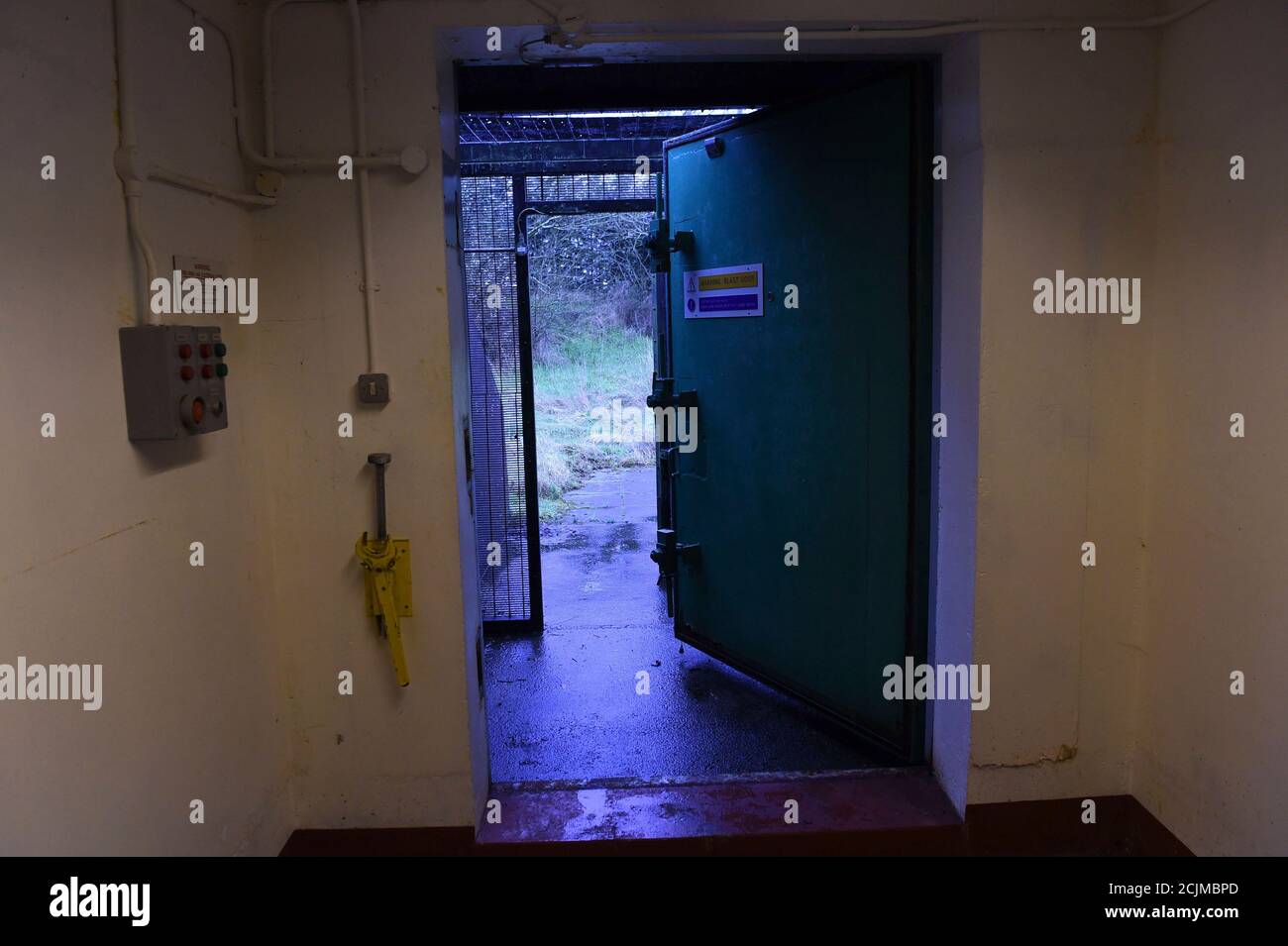 Light comes in from the open blast door at a former Regional Government HQ Nuclear bunker built by the British government during the Cold War which  has come up for sale in Ballymena, Northern Ireland on February 4, 2016. It is owned by the Office of Northern Ireland's First Minister and Deputy First Minister and capable of accommodating 236 personnel for extended periods. A large range of the original fixtures and fittings are to be included in the sale. It is believed to be one of the most technically advanced bunkers built in the UK with an array of advanced life support systems. In the eve Stock Photo