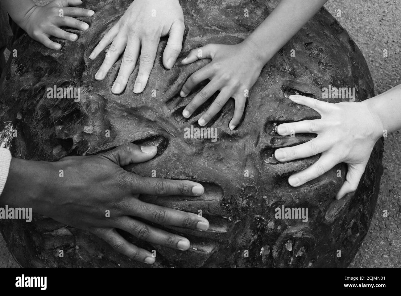 Multi Races Hand Multiple hands of different races fit into hand-prints on a piece of ...