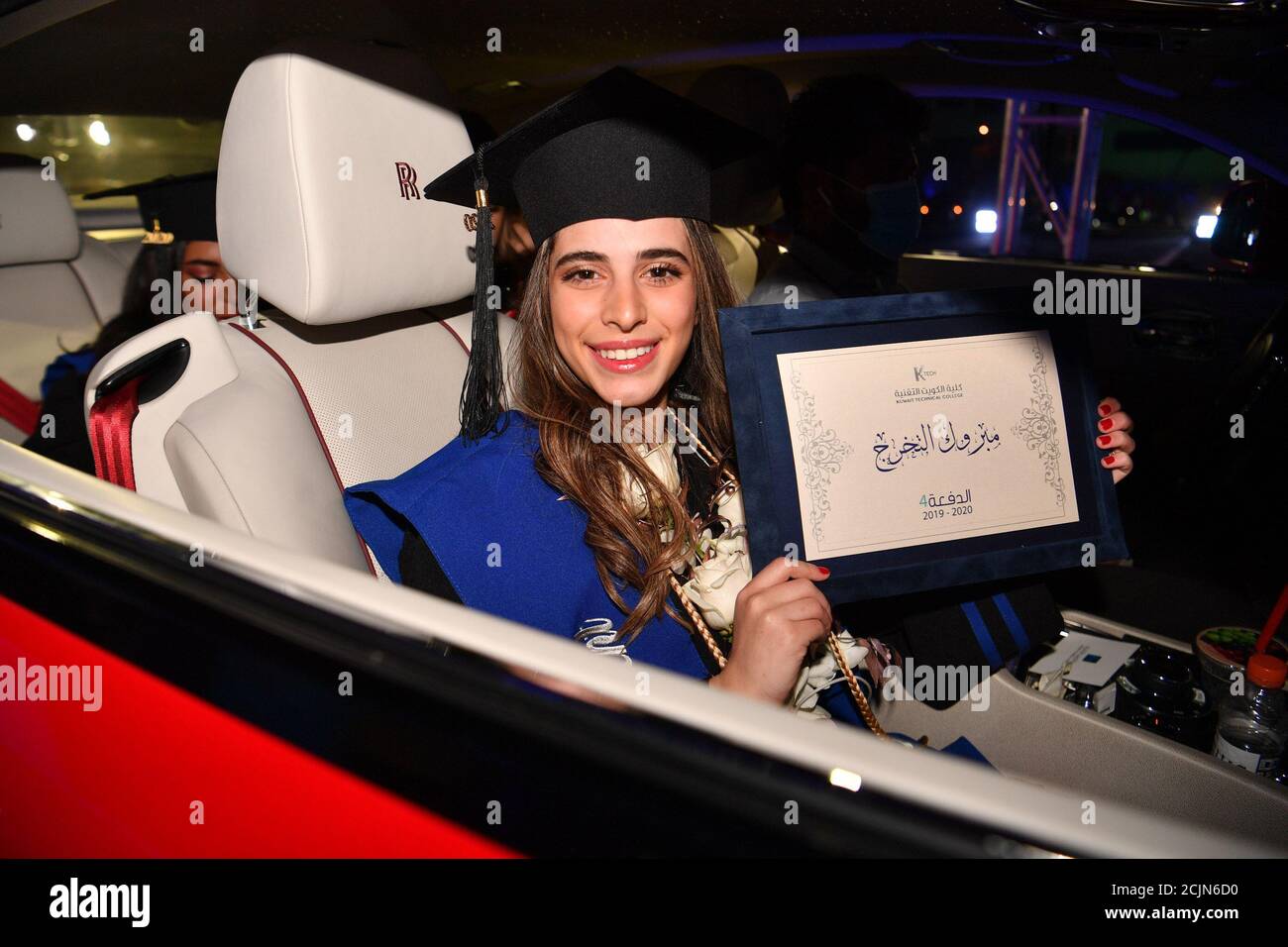 200915) -- AHMADI GOVERNORATE, Sept. 15, 2020 (Xinhua) -- A student shows a  diploma during a drive-through graduation ceremony at Kuwait Technical  College (K-Tech) in Ahmadi Governorate, Kuwait, Sept. 9, 2020. Kuwait