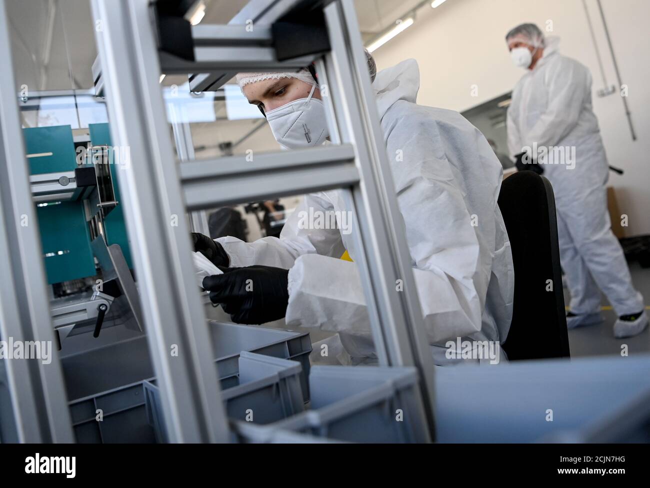 Berlin, Germany. 15th Sep, 2020. FFP2 protective masks are produced by Karl Rabofsky GmbH and packed by an employee. The machine manufacturer has started the industrial mass production of FFP2 protective masks. The aim is to produce 10 to 12 million masks 'Made in Germany' per year. Credit: Britta Pedersen/dpa-Zentralbild/dpa/Alamy Live News Stock Photo