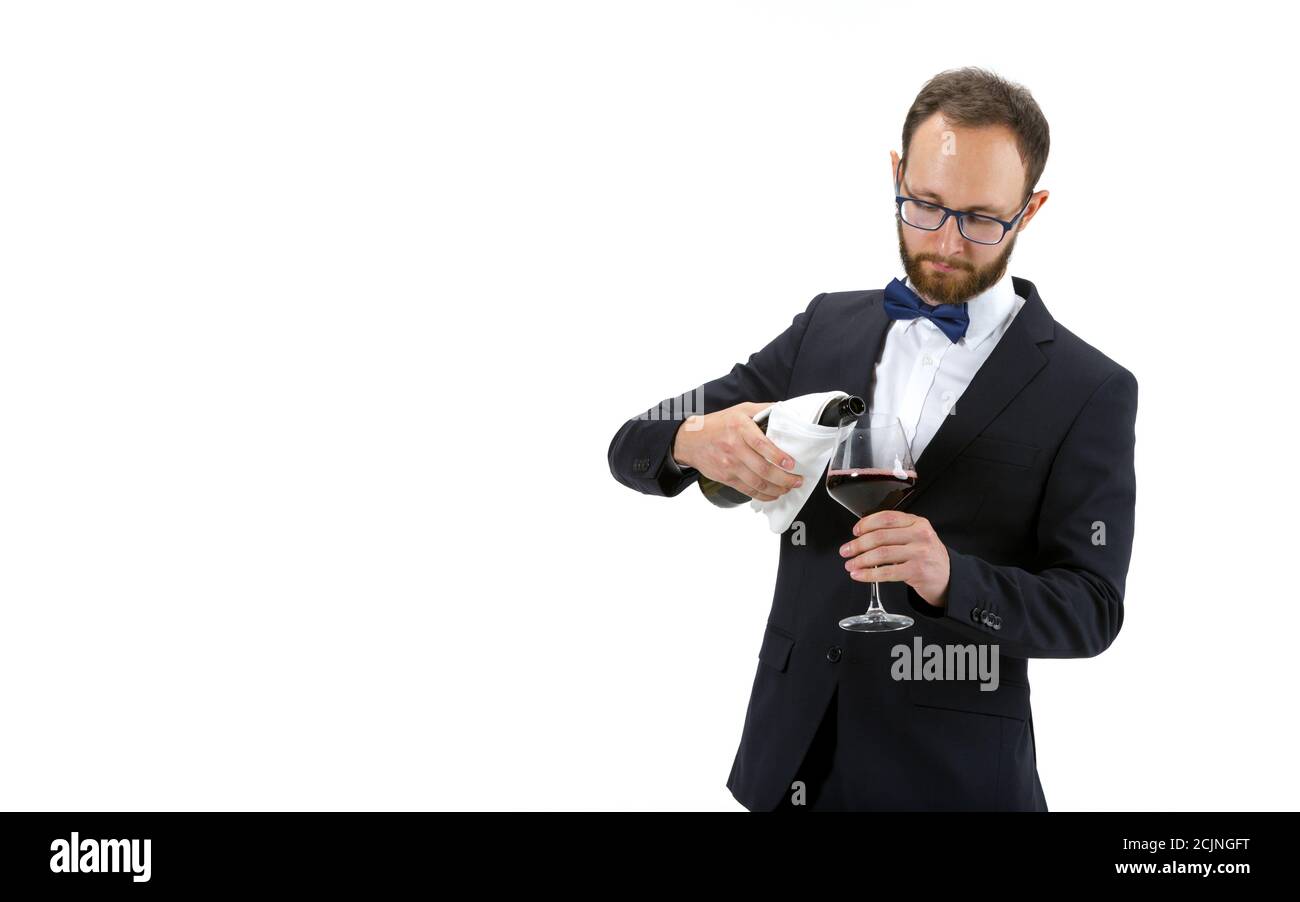 Pouring red wine. Portrait of male sommelier, wine steward or bar