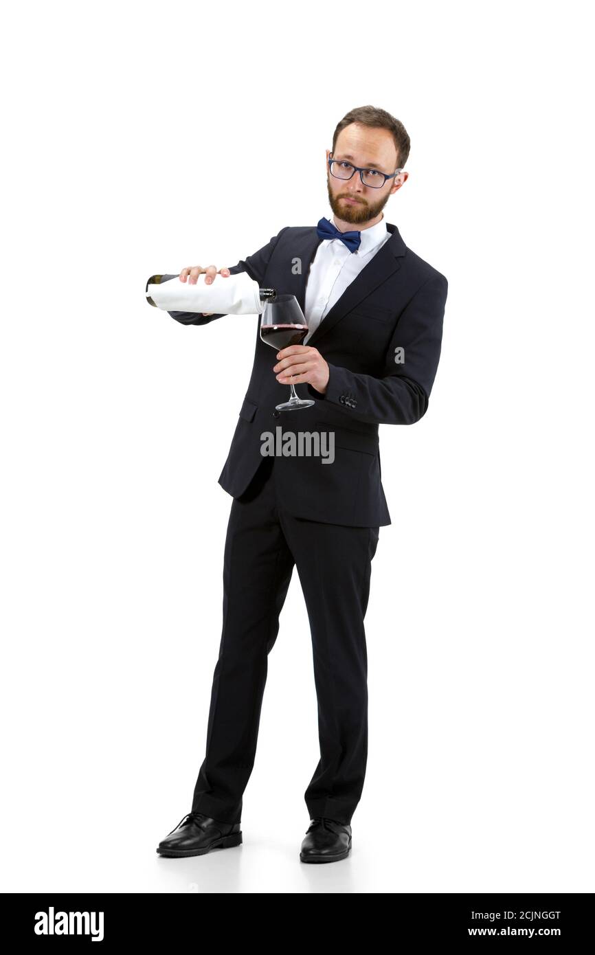 Pouring red wine. Portrait of male sommelier, wine steward or bar