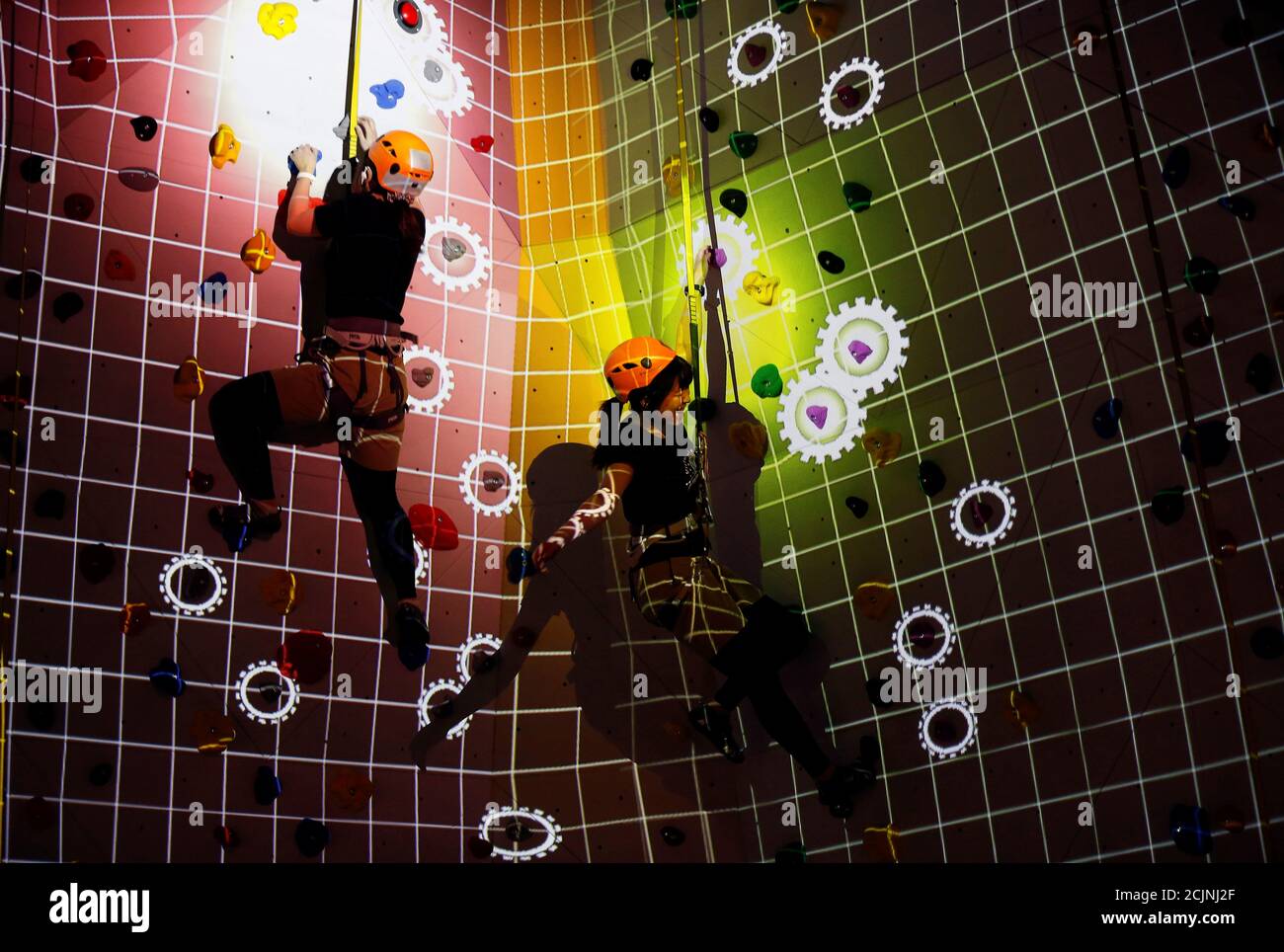 Staff Members Demonstrate An Entertainment Programme Titled Trap Climbing At Vr Zone Shinjuku Japan S Largest Class Virtual Reality Entertainment Facility Operated By Japanese Toy And Game Software Maker Bandai Namco During A