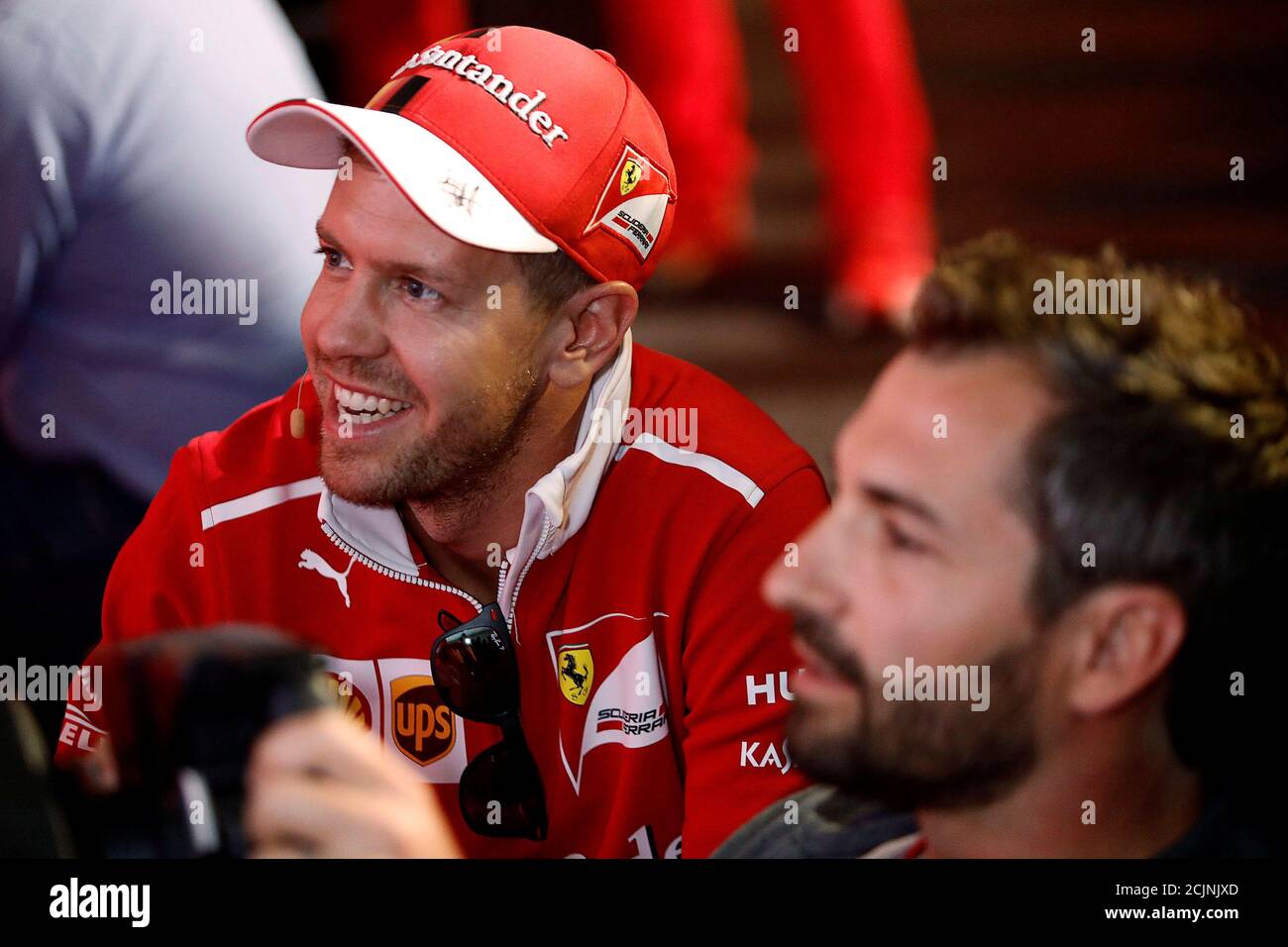 Ferrari's Sebastian Vettel of Germany smiles next to a racing simulator ahead of the Mexican F1 Grand Prix on October 29, in Mexico City, Mexico, October 26, 2017. REUTERS/Edgard Garrido Stock Photo